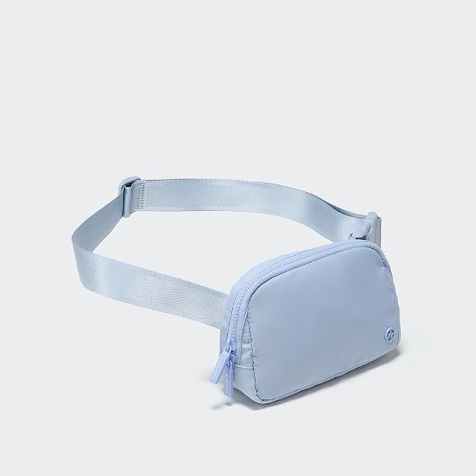 1L nylon belt bag with a two-way zipper, three interior mesh pockets, and an adjustable strap for... | Amazon (US)