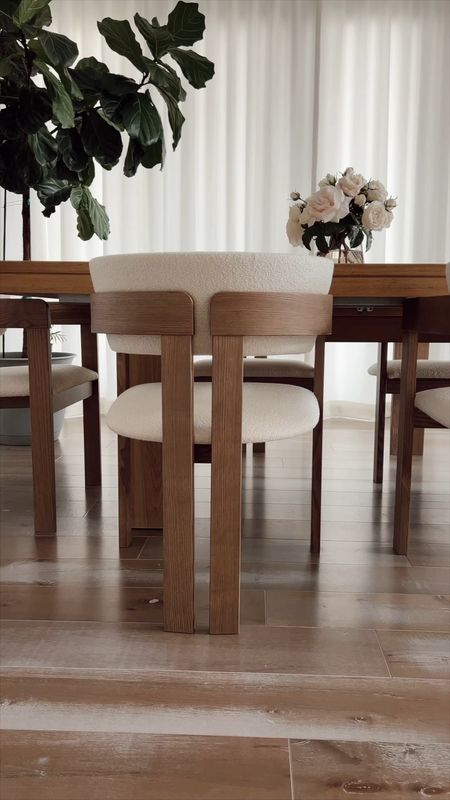 Neutral dining room with oak dining table that extends with cream and natural dining chairs that are so comfy and on sale for $300 off! Added some faux florals that are stunning and look so realistic  

#LTKstyletip #LTKhome