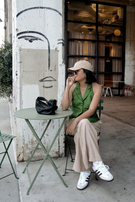 Spring outfit, pop of color, green vest, adidas Sambas, mom cap, linen pants pants 

#LTKworkwear #LTKstyletip #LTKfindsunder100