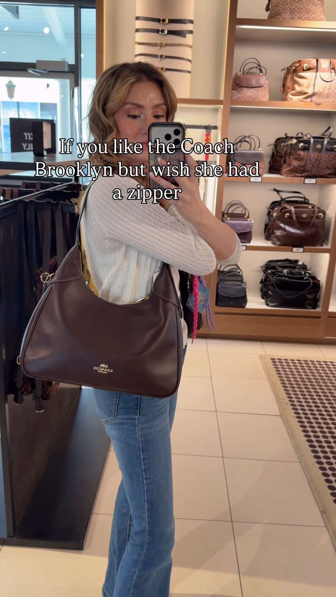 If you like the Coach Brooklyn but wish she had a zipper (and you want to save some money) try the Coach Outlet Ella! The have such a similar slouchy crescent shape and come in dark brown and black! The Ella is available in white as well. 

I have the Brooklyn 28 in this video so the Ella is a bit bigger, probably closer to a Brooklyn 34
