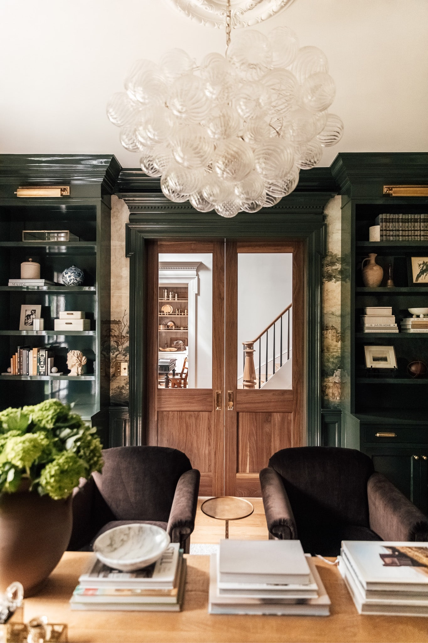 I’m defining my style as Moody Modern Traditional on ChrisLovesJulia.com today. Get the full details and find out what’s been inspiring me lately on the blog.

Study, built ins, books, bookends, vases, leather chairs, bubble chandelier, pocket doors, wall mural

#LTKstyletip #LTKhome