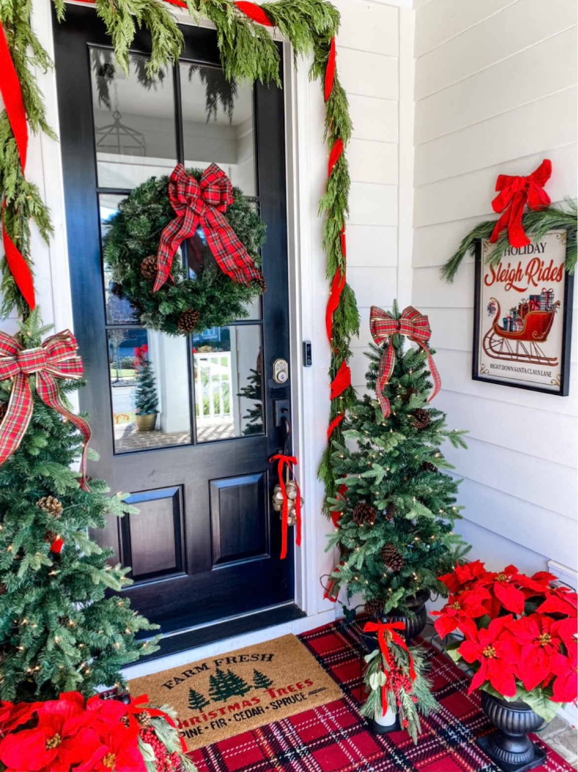 Outdoor front porch holiday and Christmas decor! Wreaths trees ribbon wall art faux poinsettias lanterns rugs etc! All on SALE!

#LTKhome #LTKSeasonal #LTKHoliday