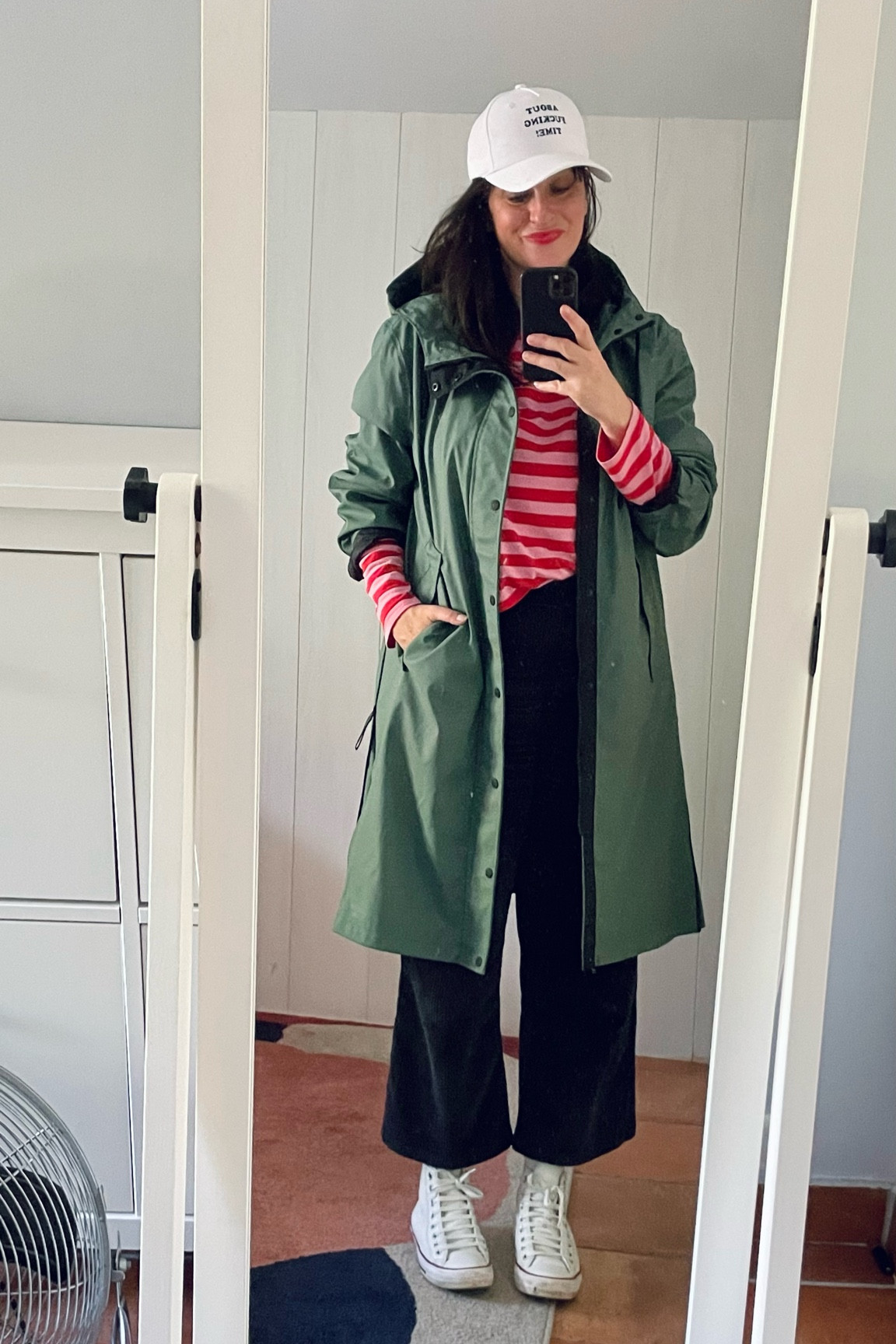 . "About fucking time" white cap #stellamccartney 
. Green "Jayce X" raincoat #americatoday 
. Red & pink striped tee #monki (linked) 
. Navy corduroy crop flare #monoprix (linked)
. White leather Chuck Taylor sneakers #converse (linked)
. Poppy red lipbalm #labello (linked)


#LTKautumn #LTKmidsize #LTKfrance