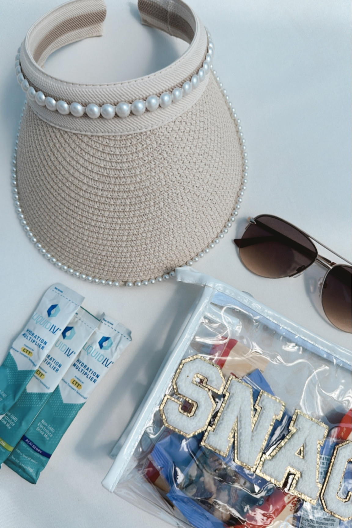 Beach essentials 
Snack bag
Liquid iv 
Visor hat came from a local boutique but I linked similar 

#LTKSeasonal #LTKtravel #LTKswim