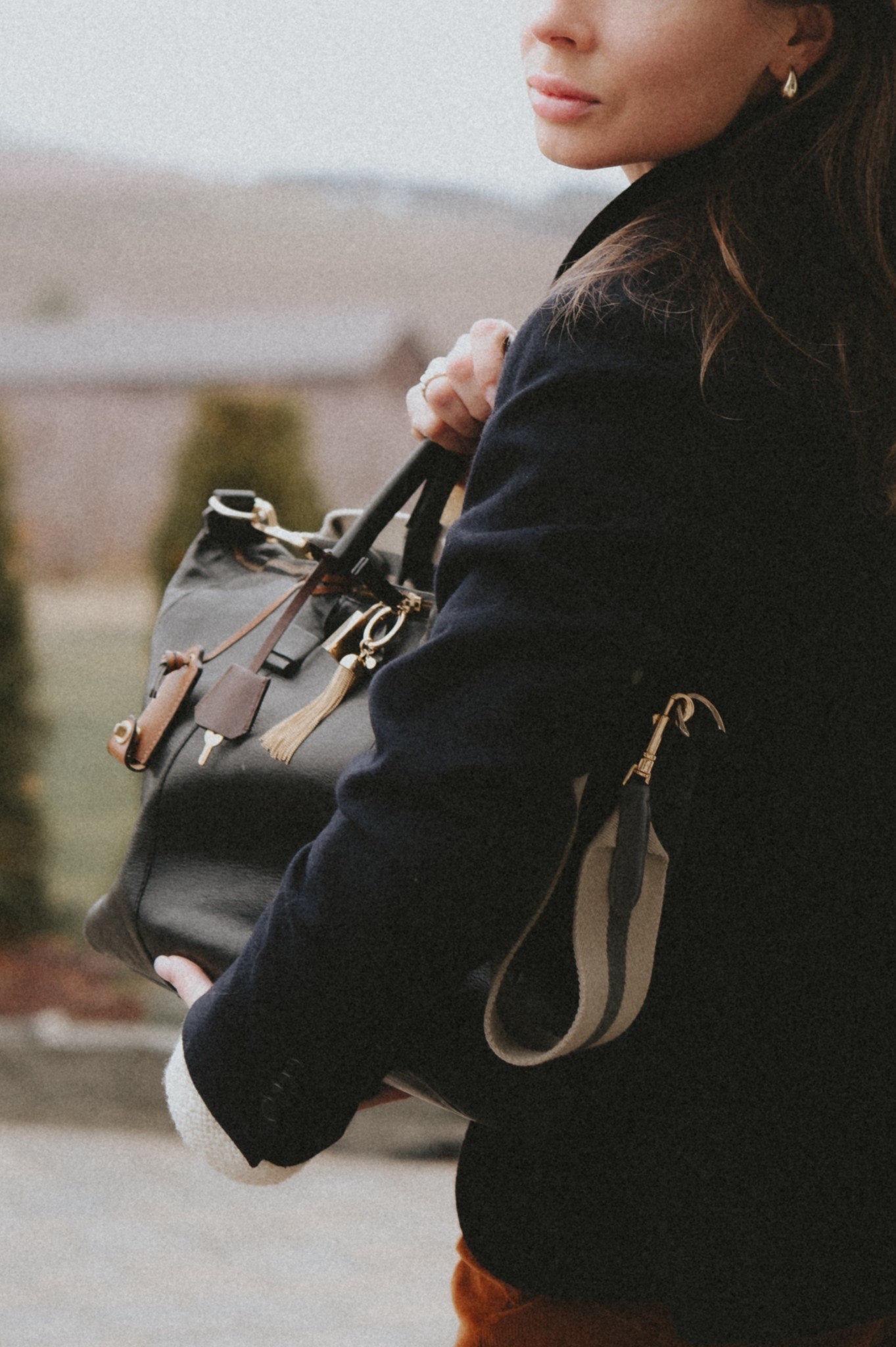 Over-accesorizing my old Boston bag and dreaming of a few more charms, tassels and tags 🏷️ to add to it:  gives new life to a boring bag & serves as a spare toy for Benji 🤗

#LTKFindsUnder50 #LTKFindsUnder100 #LTKmomlife