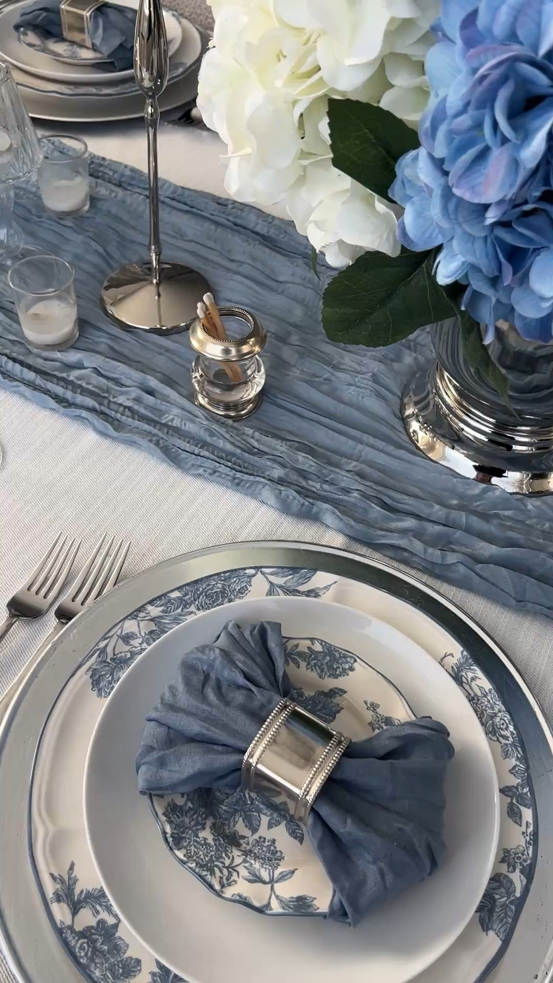 Blue and white floral tablescape, perfect for Mother’s Day brunch! Tablescape with silver pieces, silver charger, silver napkin ring, silver ice bucket, real touch hydrangeas, vintage floral tablescape, blue and white table decor, French blue toile plates, blue and white floral ceramic dishes 

#LTKHome #LTKSeasonal