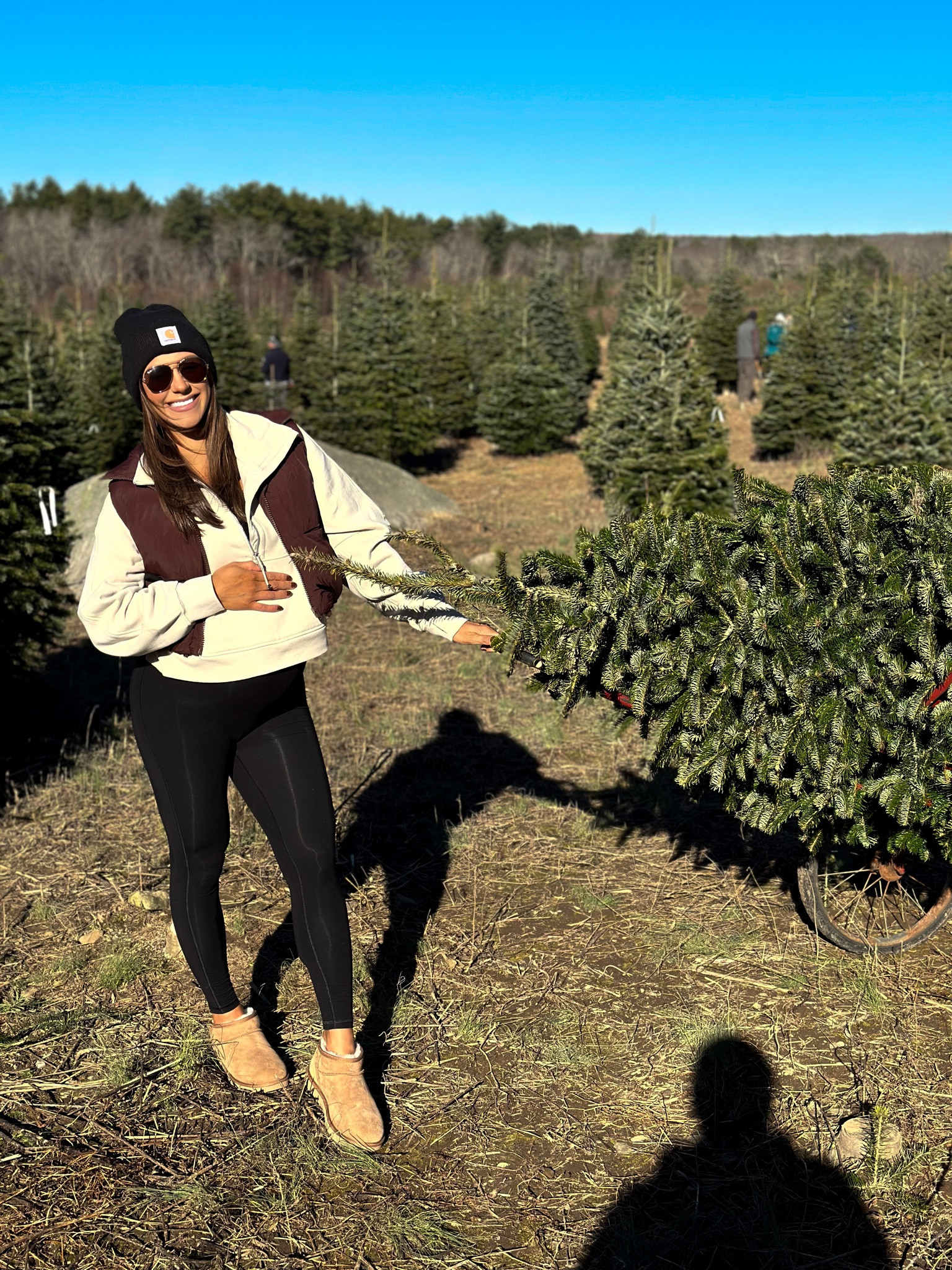 • brown cropped Amazon puffer vest 
•lululemon cropped 3/4 zip 
•GAP maternity onesie jumpsuit 
• chestnut ultra mini Uggs 
• Carhartt beanie 

Bump style, maternity, pregnancy fashion, 37 weeks pregnant 