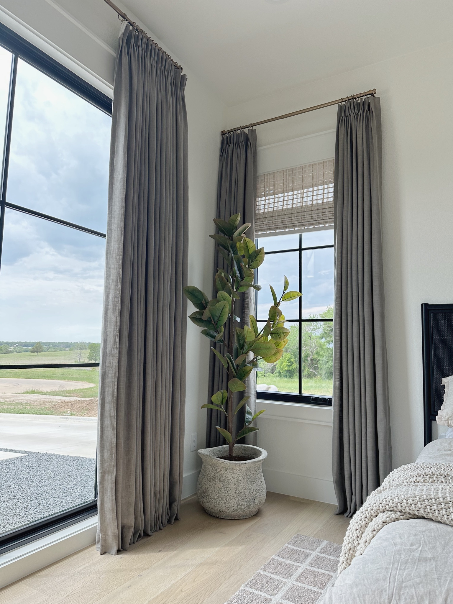 Guest bedroom decor🤍 Curtain color is called Pure Cashmere Grey  

Indoor planter. Target tree. Faux tree. Fake tree. Twopages curtains. Custom curtains. Roman shades. Loloi rug. Checkered rug  Waffle blanket. 

#LTKhome