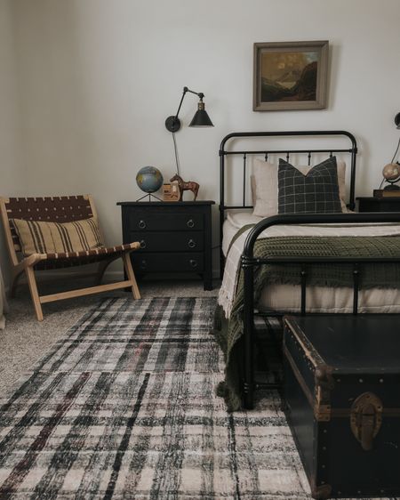 Boys room, plaid rug, pillow cover, black trunk, black nightstand, oil painting, metal bed 

#LTKhome #LTKFind