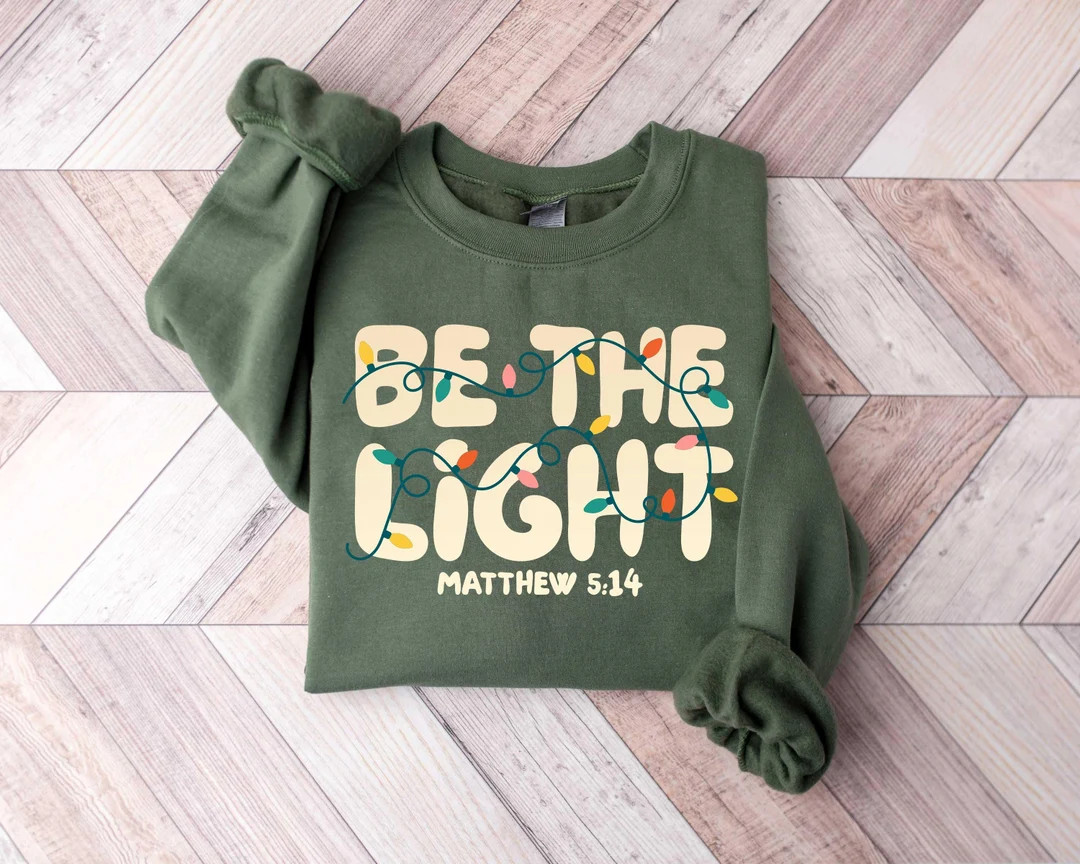 Be The Light Sweatshirt, Christmas Religious Shirt for Family, Christmas Lights Sweatshirt, Faith... | Etsy (US)