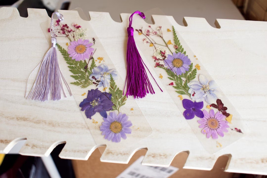 A little beauty for every page 📖 These handmade dried flower bookmarks from HandCraftByCoco are crafted in the USA using real pressed florals and delicate gold leaf, sealed in a clear laminate for lasting charm. Each one is completely unique, making it a thoughtful gift for book lovers, teachers, or anyone who appreciates small handmade details. Plus, you can customize the tassel color for an extra personal touch. 🌸 #LTKfinds #BookLoversGift #HandmadeEtsy #DriedFlowers #UniqueBookmarks #GiftIdeas #SmallBusinessLove

#LTKGiftGuide #LTKHoliday #LTKdayinmylife