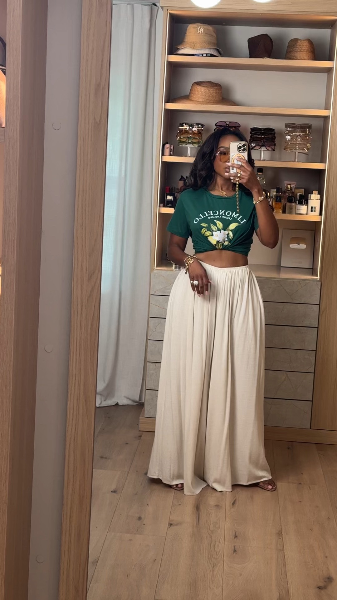 Hi Babes! 💚🤍✨

This is one of my favorite ways to dress up a graphic tee! Pairing it with flowy wide leg pants instantly gives it that effortless, elevated look while still being super comfortable.

✨ Fit Details:
• Wearing a size Small
• Graphic tee (styled knotted)
• High-waisted flowy wide leg pants
• Lightweight, comfortable fit
• Styled with gold jewelry and neutral heels

🤍 Where to Wear:
• Brunch
• Vacation days
• Farmers markets
• Casual lunch dates
• Weekend shopping
• Travel days

I love mixing casual and elevated pieces like this—it makes the outfit look intentional without trying too hard!

Everything is linked below!

xx, Kira | IG: KirasFashionFinds

Measurements:
Kira: 5'4" | Size Small | 140 lbs