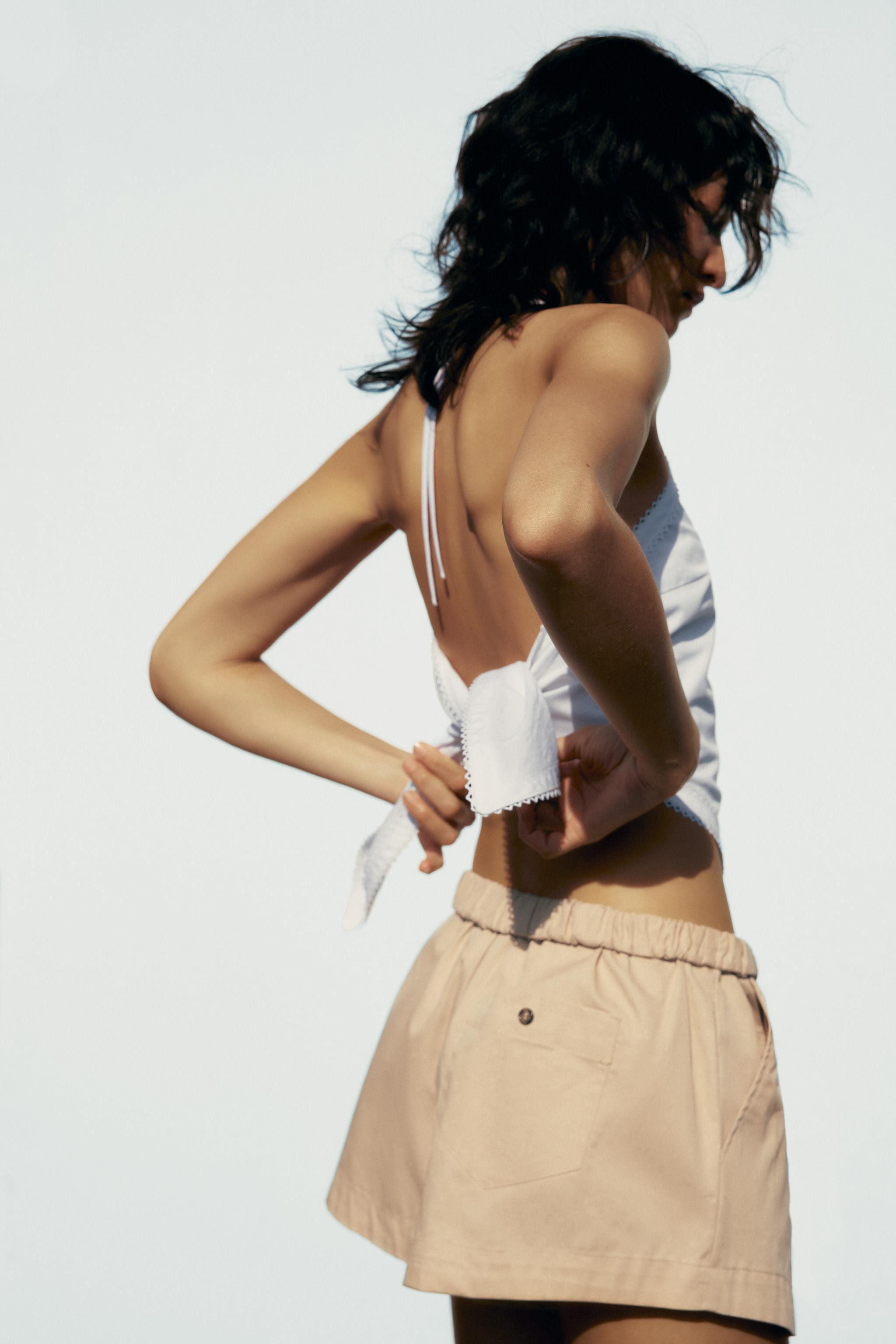 Mid-rise mini shorts. Elastic waistband with fold-over. Side pockets and back patch pockets. Butt... | Zara US