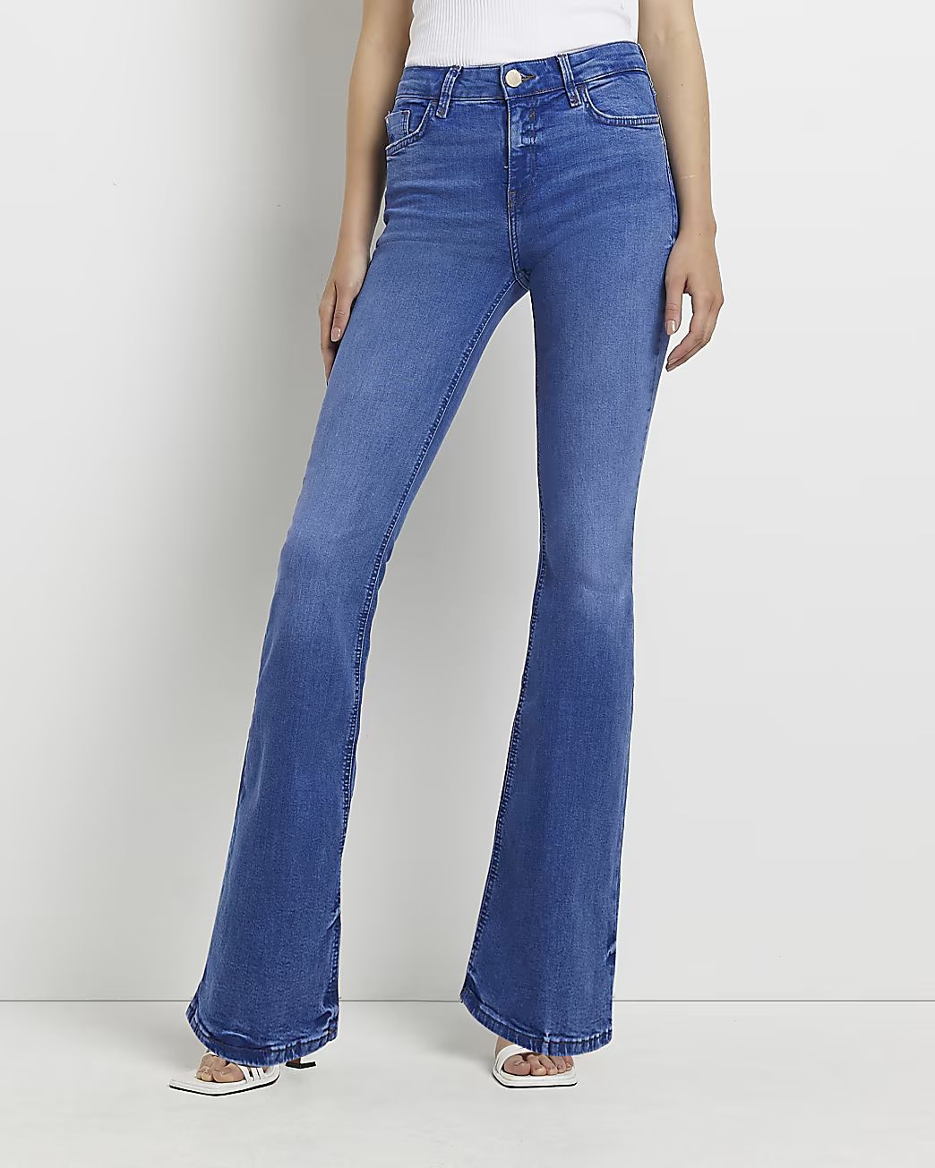 Blue mid rise flared jeans | River Island (UK & IE)