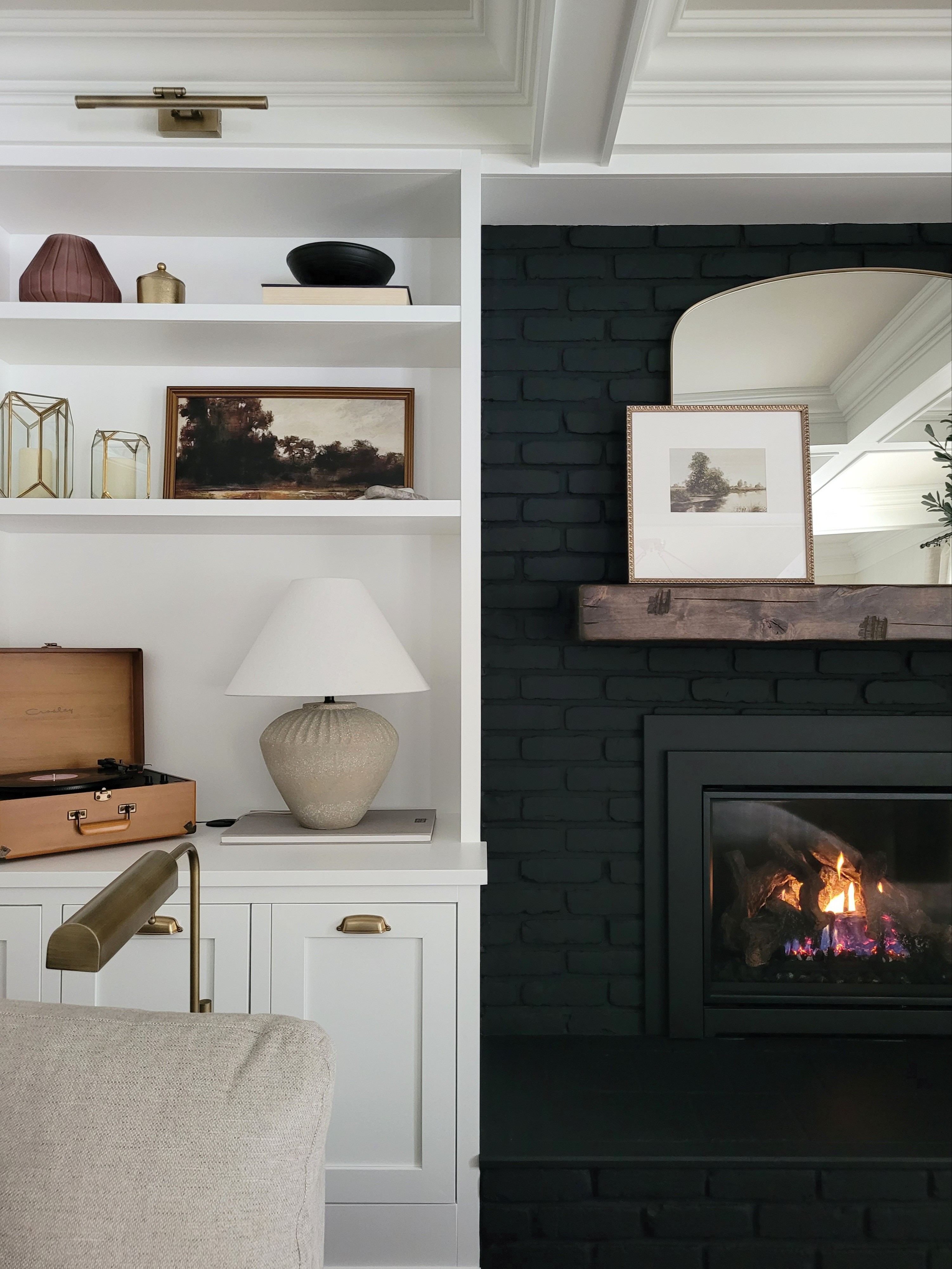 Living room family room shelf styling,  black fireplace built in shelving,  warm neutral styling,  wood mantle,  mantle styling,  target home,  Amazon home, pharmacy lamp, cabinet pull,  cabinet hardware, gallery frame,  gallery light,  art light

#LTKHome #LTKStyleTip #LTKFindsUnder100