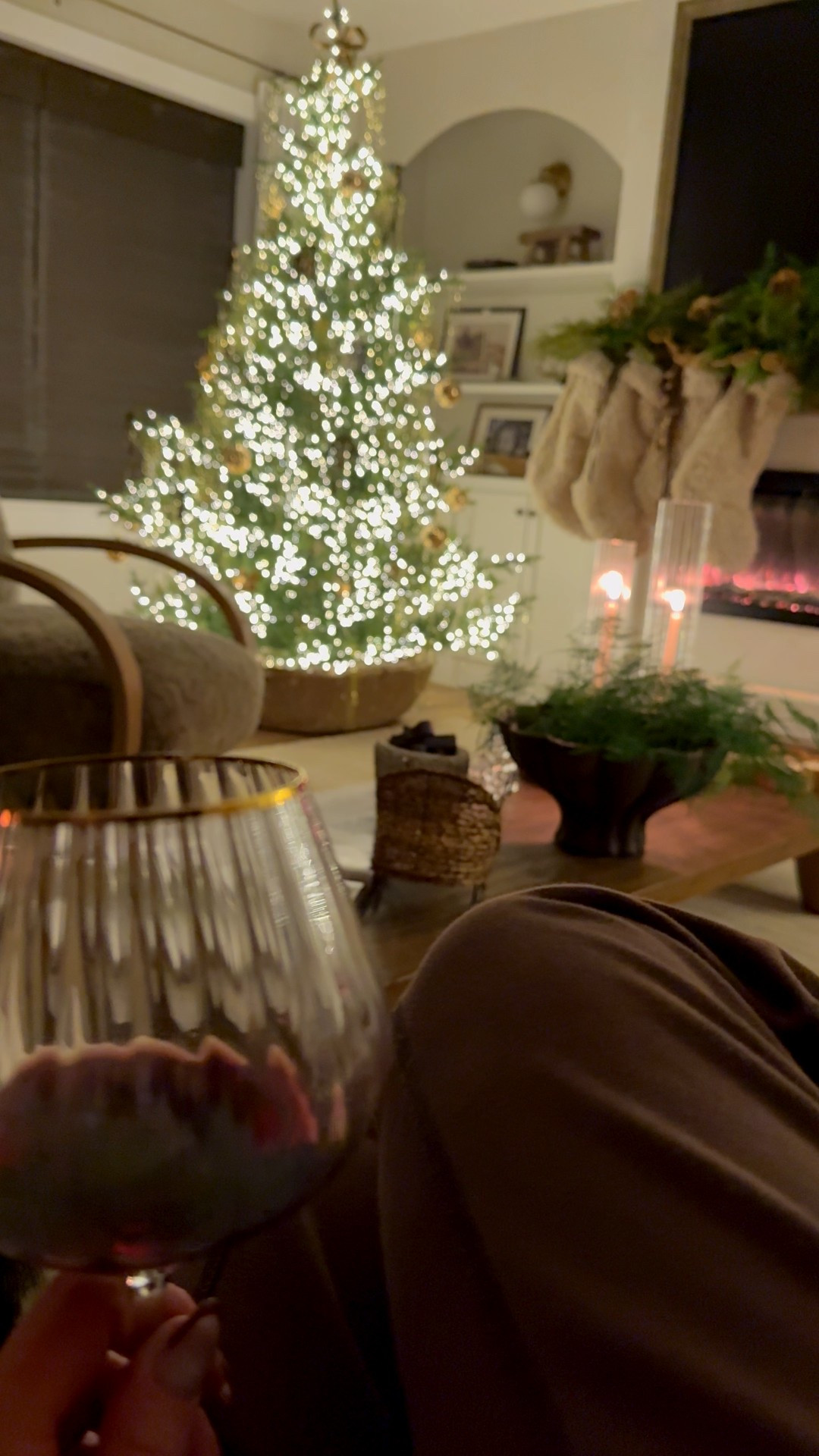 Cozy Christmas living room with 2 trees! The second tree shown is still in stock. It’s 5’ and I have it in a vintage olive jar. These wine glasses are so pretty! 

#LTKHome #LTKGiftGuide #LTKHoliday