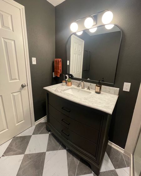Need an easy and cost friendly bathroom update?! Peel and stick tile, paint your vanity, new pulls, new mirror, new light and you’ve got it 🙌🏼 all for under $500. The all
Black light is currently out of stock, but I tagged the black and gold! 

#LTKhome