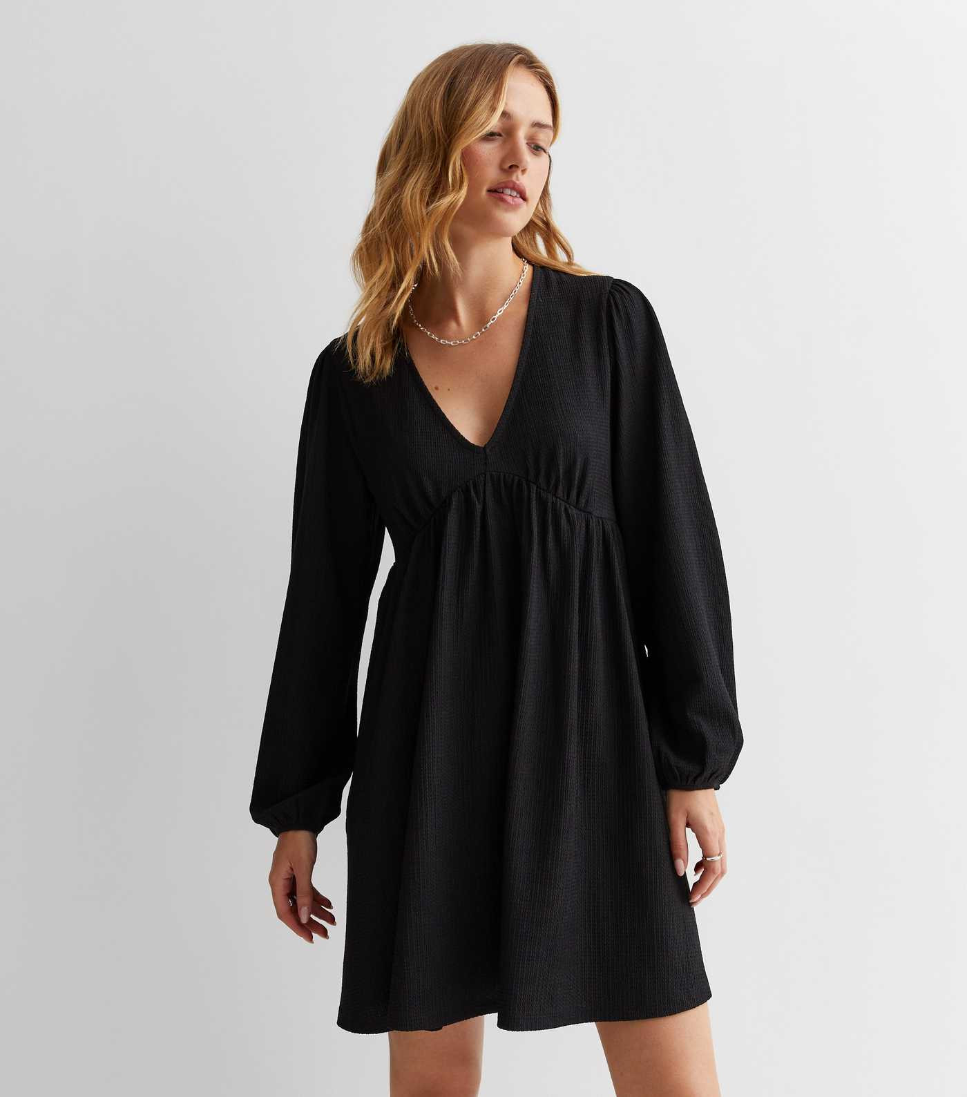 Black Textured Jersey Long Sleeve Mini Smock Dress
						
						Add to Saved Items
						Remove f... | New Look (UK)