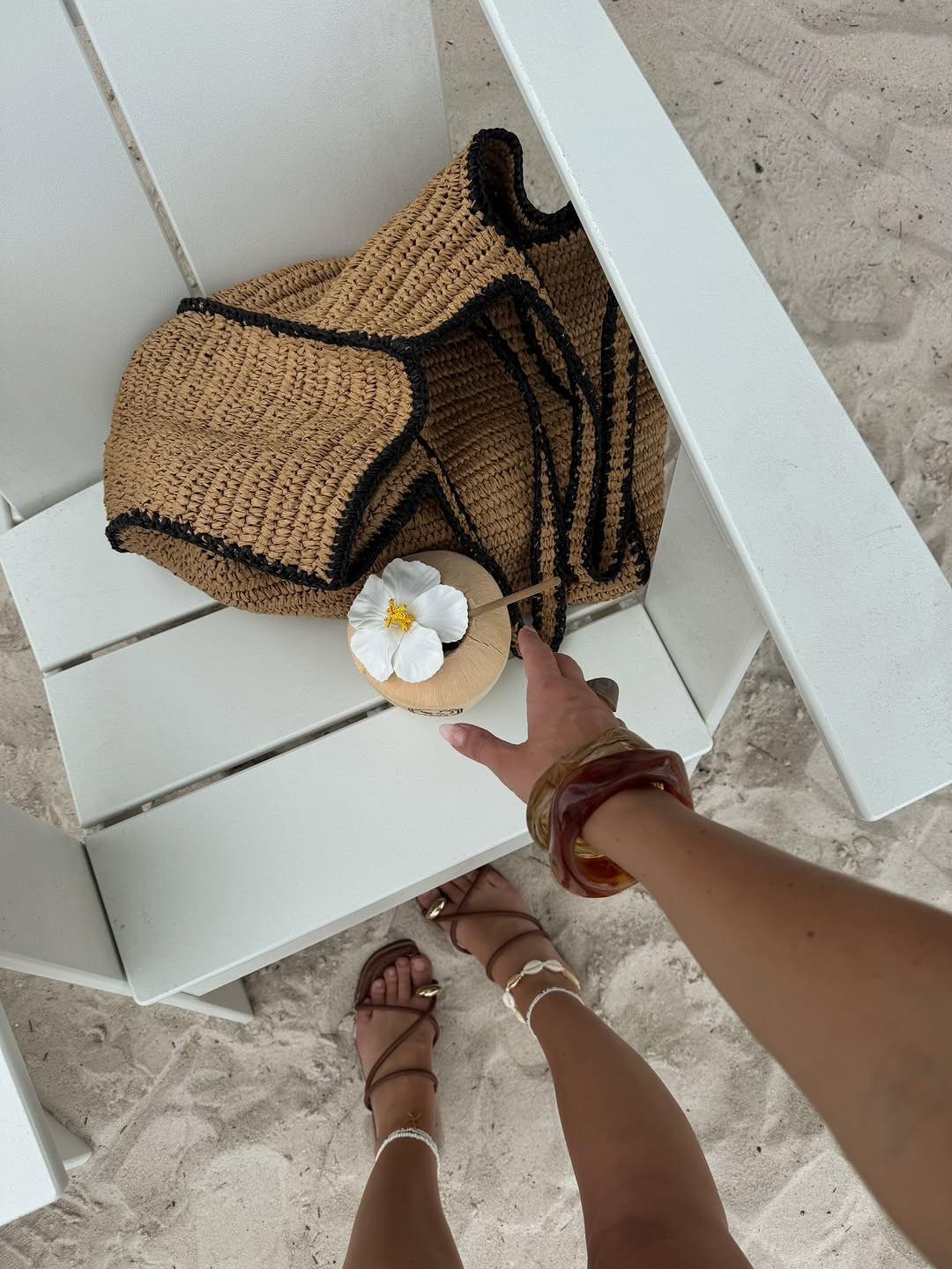 Beach day essentials: the perfect straw bag, shell details, and a refreshing coconut. Click the link in bio to shop the look! #beachstyle #summeraccessories #vacationmode 

 #LTKootd #LTKSaleAlert #LTKSwim