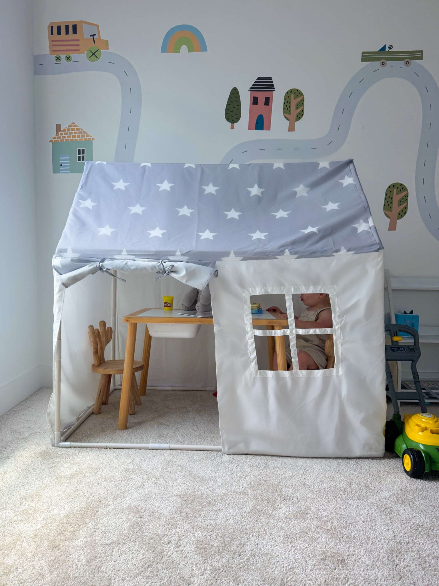 Toddler-friendly playroom setup featuring a cozy indoor play tent, a Montessori-inspired sensory table, and colorful road map wall decals for imaginative play. Perfect for creating a functional and fun bonus room or play space for toddlers and kids.

#toddlertoys #bonusroom #playroom #playtent #kidsroom #firstbirthdaygifts 

#LTKHome #LTKKids #LTKBaby