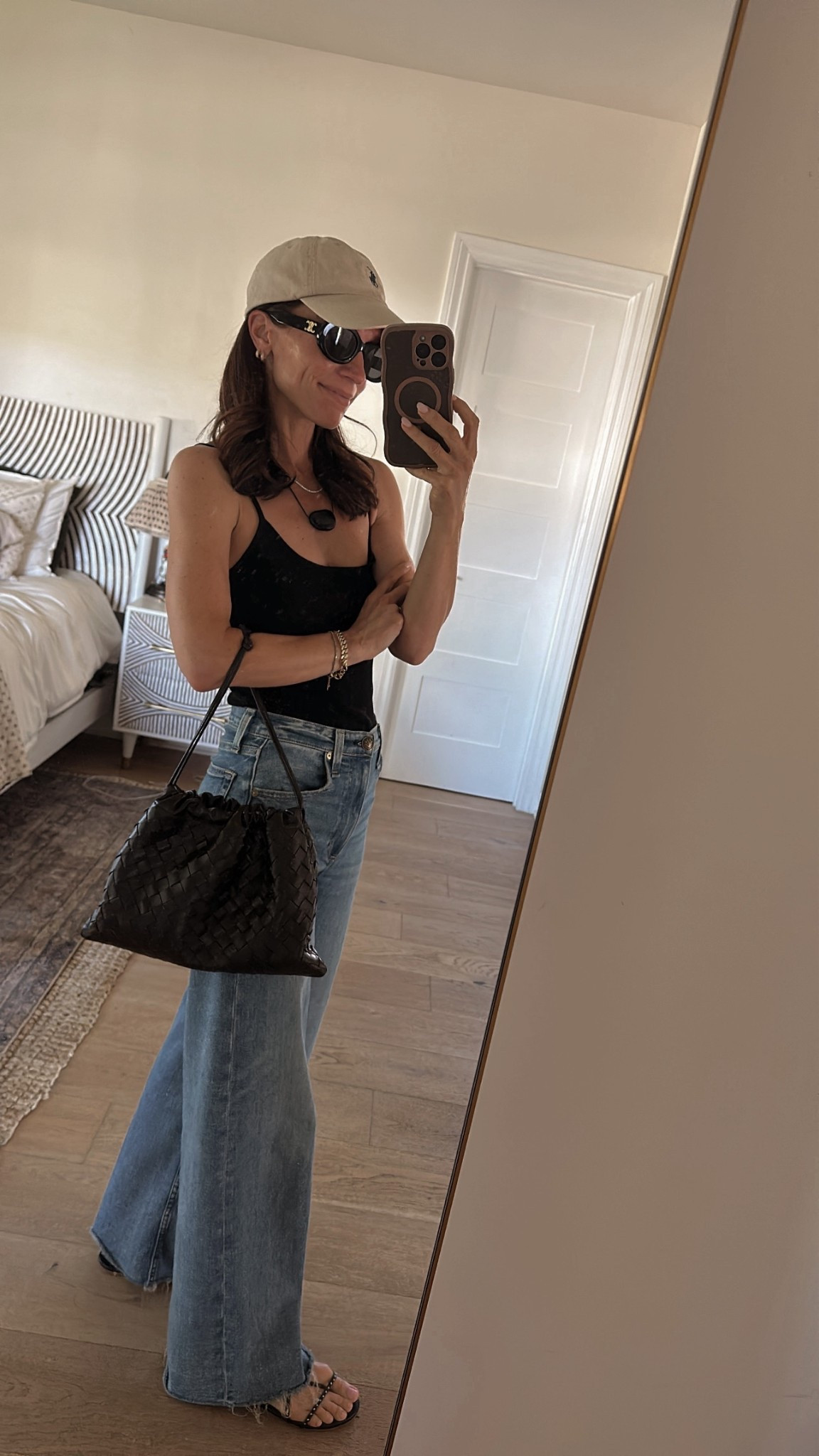 Kept today’s outfit casual and low lift 
Wore the tank that I bought for my recent spring break trip (wore it with a black silk skirt and a black gingham skirt on vacation) with a go to pair of jeans and barely there sandals 

#LTKOver40 #LTKPetite