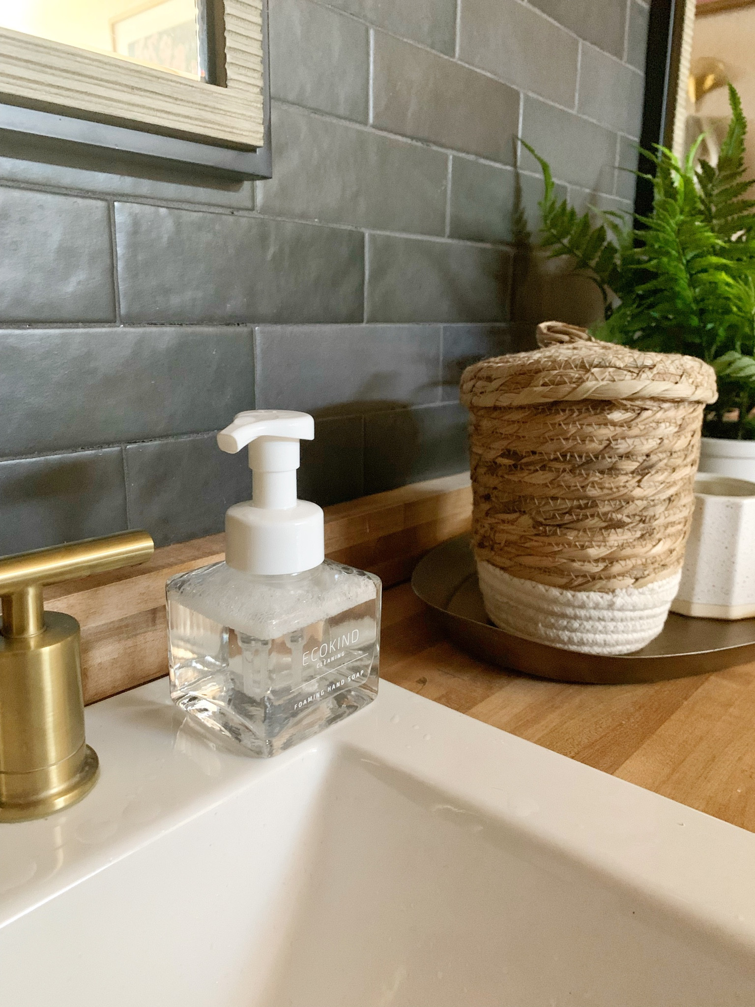 Bathroom makeover including a new faucet, sink, tile, candle, mirror, and more!

#LTKunder100 #LTKhome #LTKunder50