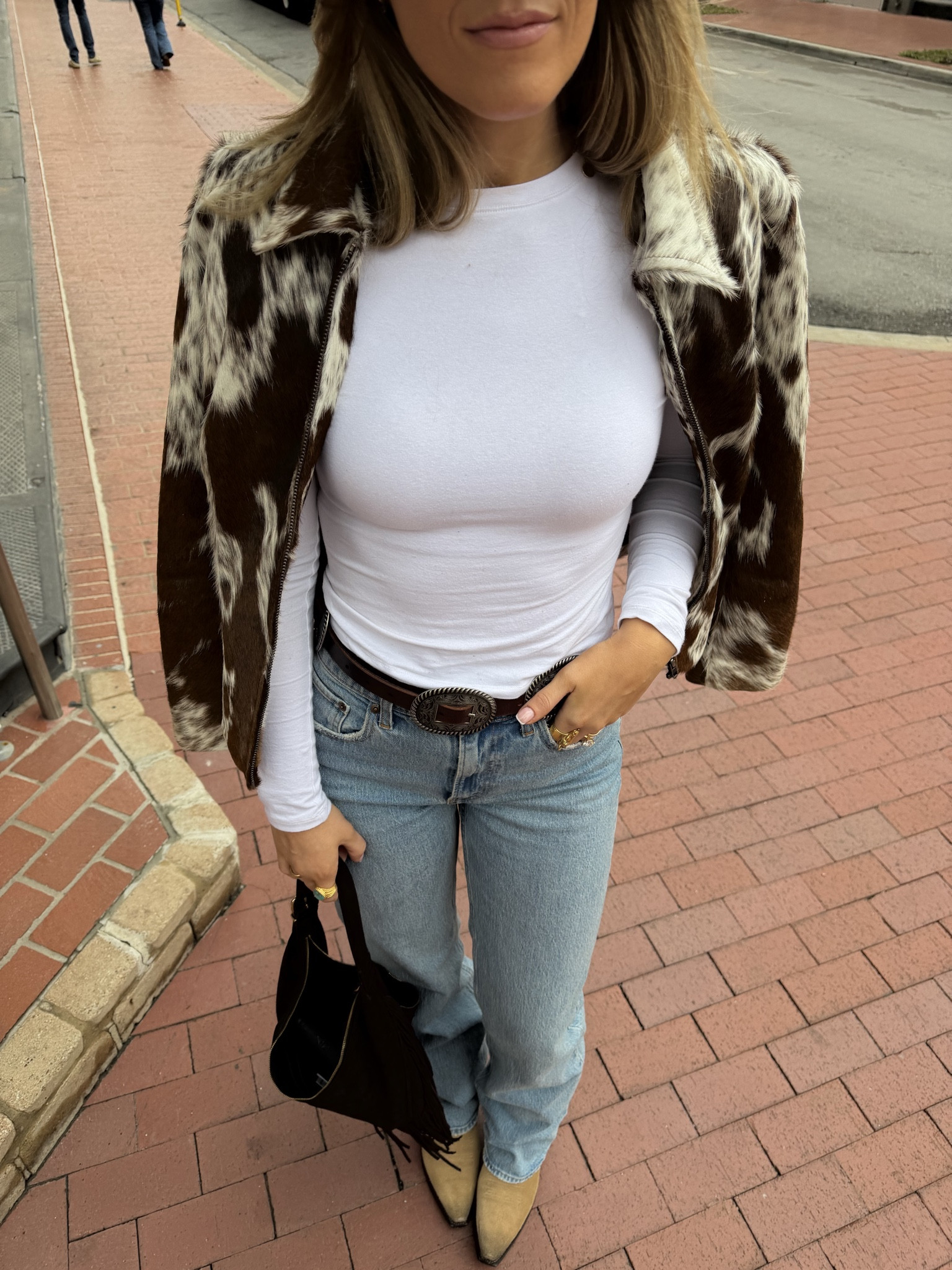 size 26 extra tall in jeans, small in long sleeve, cowhide jacket is a custom size but when you measure i suggest giving yourself some extra room or you can order a standard size! size XS in belt and size down half size in boots 

#LTKSpringSale #LTKTall #LTKootd