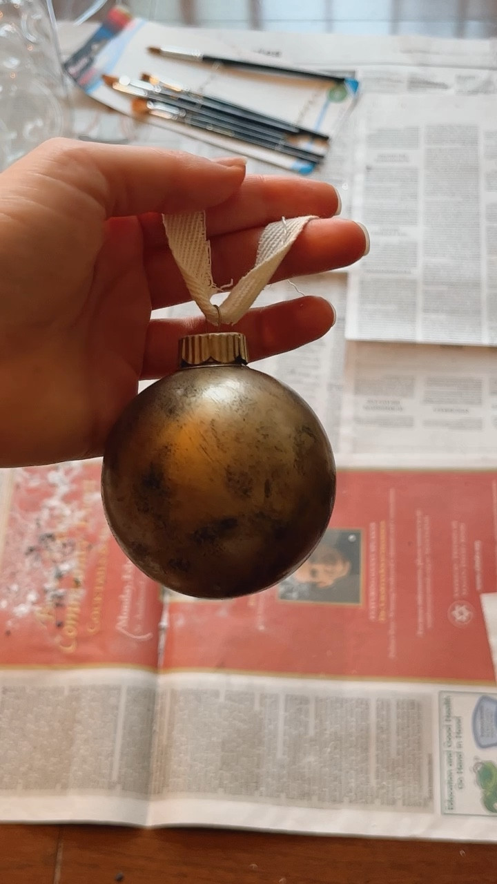 DIY antique looking ornaments! ✨

STEPS:
1) Spray paint with gold paint 
2) Use black paint and dab it with a sponge brush around the ornament to give it the antique look
3) Tie a piece of ribbon so you can hang your ornament🎄

#LTKSeasonal #LTKHoliday #LTKhome