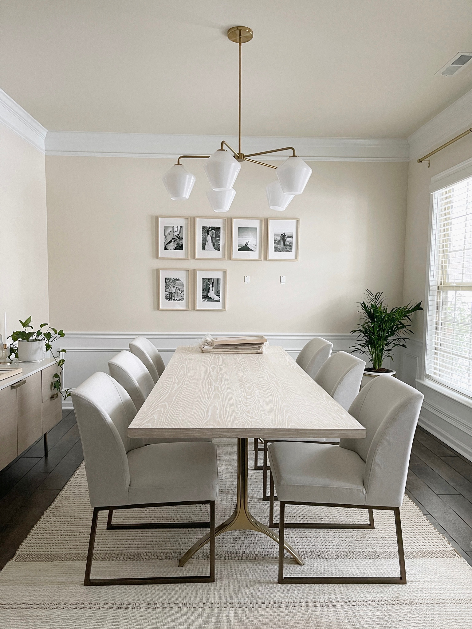 Formal dining room progress photo. Light fixture changed, added a rug, & hanged some family pictures!

#LTKFind #LTKhome #LTKstyletip