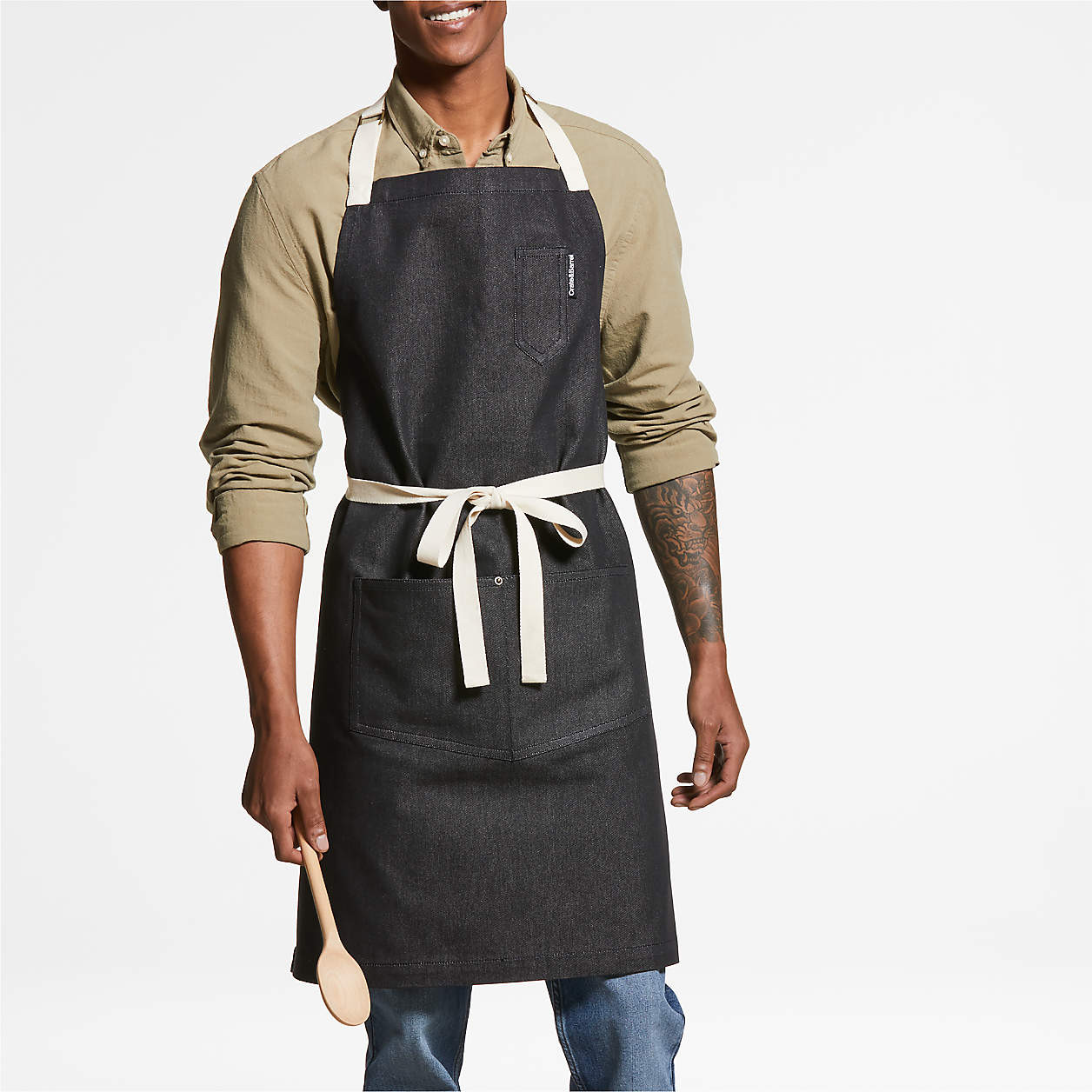Black Organic Cotton Kitchen Apron with Pockets + Reviews | Crate & Barrel | Crate & Barrel