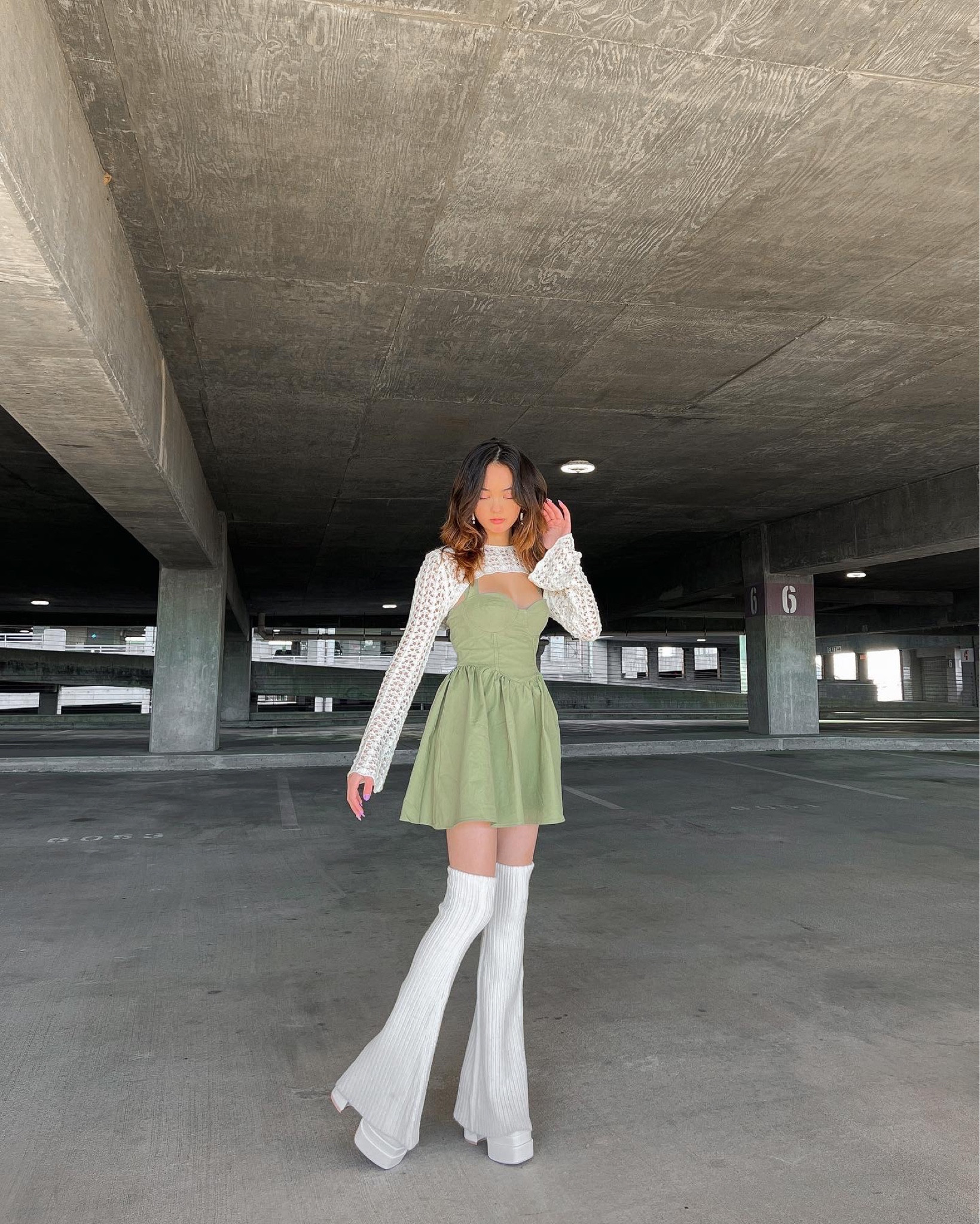 fishnet crop top long sleeve bolero white bolero green mini dress halter top dress green corset dress spring mini dress white leg warmers knee high leg warmers white platform heels chunky white heels