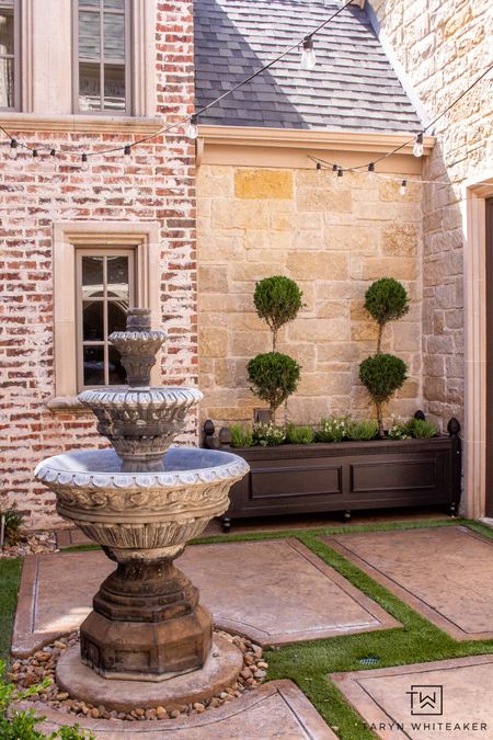 European inspired exterior and courtyard design. Get the supplies to build your own large planter box!! Tutorial is on the blog! 

#LTKhome #LTKeurope #LTKSeasonal