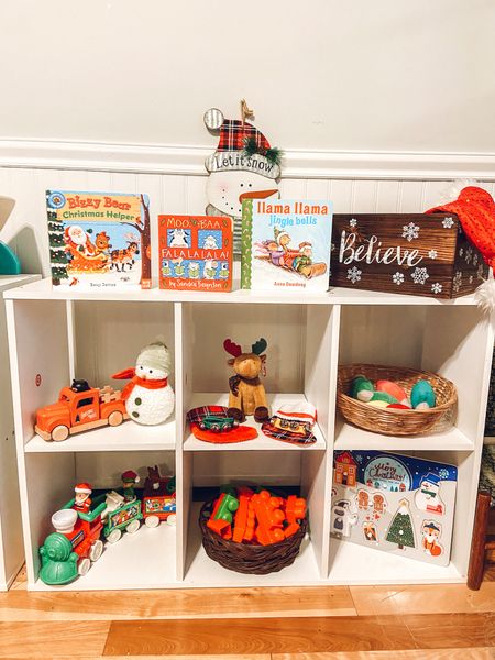 Our Christmas themed toy shelf is ready for play!! I can’t believe Christmas is just a couple sleeps away!

On the very top-
🎄Bizzy Bear Christmas Helper book
🎄Moo Baa Fa La La La La book
🎄Llama Llama Jingle Bells book
🎄Wooden decorative box with Santa hat

Top Shelf Left to Right-
🎄 @magnolia little red truck with peg bear
🎄 Snowman from @target’s dollar spot
🎄TY Beanie Baby Christmas moose
🎄Jingle bells & mini stockings we’ve had forever!
🎄Light bulb garland from @target that I ended up just cutting from the string

Bottom Shelf Left to Right-
🎄 @fisherprice Christmas train
🎄 green & red MegaBlocks
🎄 Christmas puzzle from @target dollar spot

We’re slowly building our themed collections, and this year was a lot of random pieces put together! I wanted to buy as little as possible, so I tried to be creative to fill the shelves. I just wanted to share our very imperfect shelf to encourage other mamas that it’s ok if the shelf isn’t decked out with bells & holly! 😉

#LTKSeasonal #LTKHoliday #LTKkids