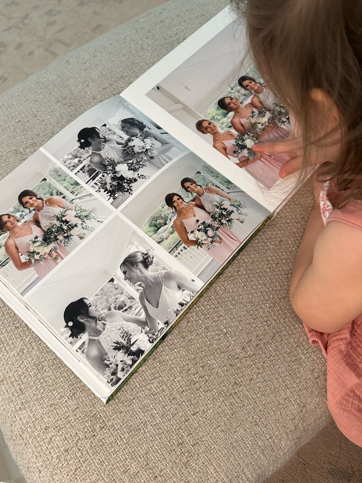 Going through my wedding album with my baby girl!!! So surreal! I ordered this years ago from Shutterfly and so happy with it. I believe i created my own design so i had more freedom with the layout! 