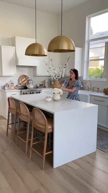 Spring kitchen refresh! Love our white kitchen with wood accents. These wood counterstools are amazing, and I love all these great affordable Target finds. Faux florals, gold dome pendants



#LTKFind #LTKSeasonal #LTKhome
