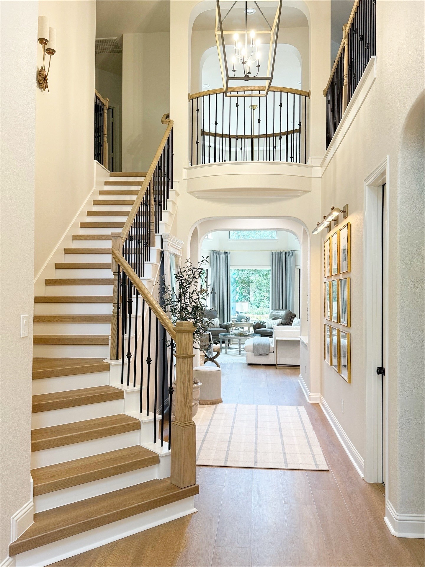 Last close-up of this gorgeous project. Don’t be afraid to create multiple ‘moments’ in long entryways like this! It sets the tone for the entire home. 🩵 #WoodlandsStyleHouse 
Construction: @richmarkremodeling 

#LTKHome #LTKStyleTip #LTKFamily