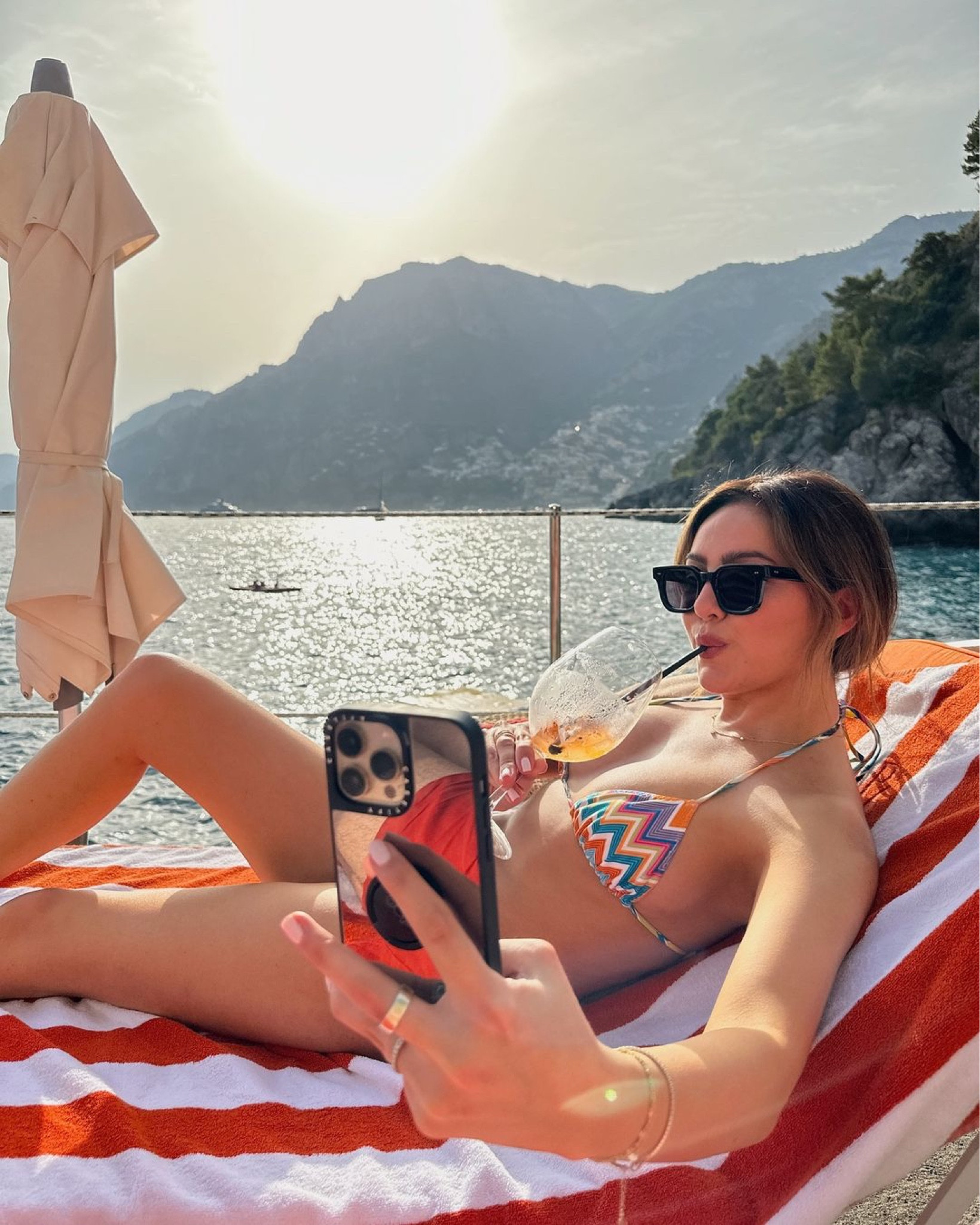What I wore in Italy 🍋 chevron bikini, oversized sunglasses, metallic phone case

#LTKSummerSales #LTKSwim #LTKSeasonal