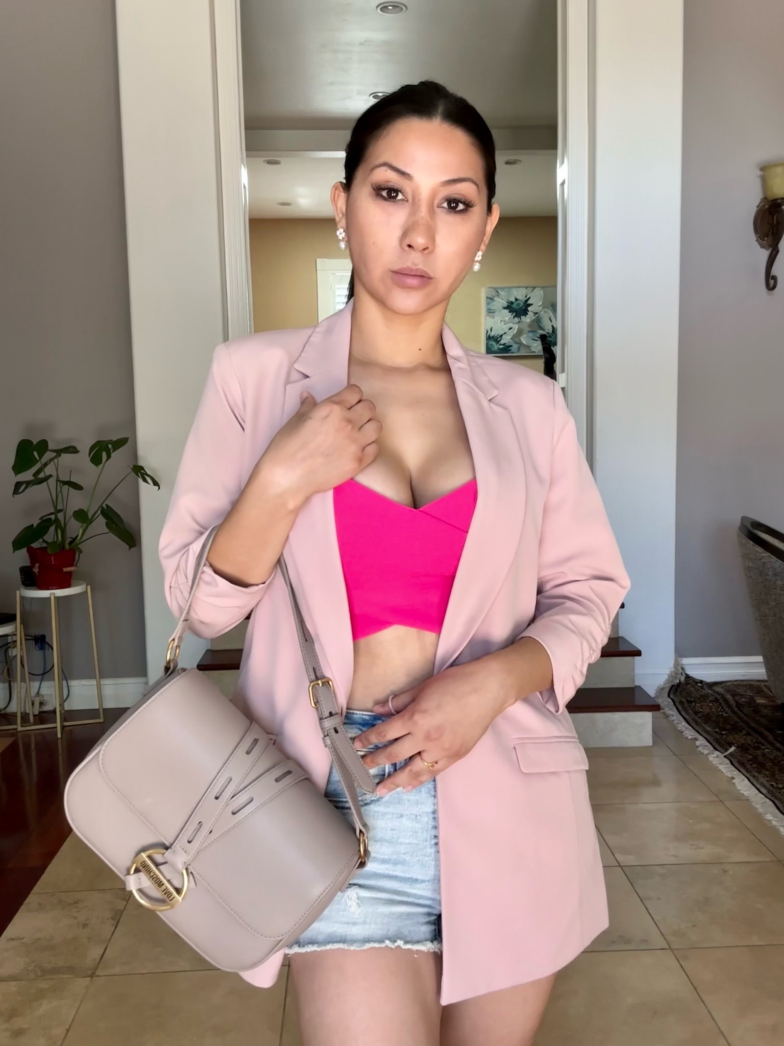 Casual style. Wearing a high waisted shorts from American Eagle, Moschino bag, a crop top from H&M and a pink blazer 

#LTKFind #LTKbeauty #LTKstyletip
