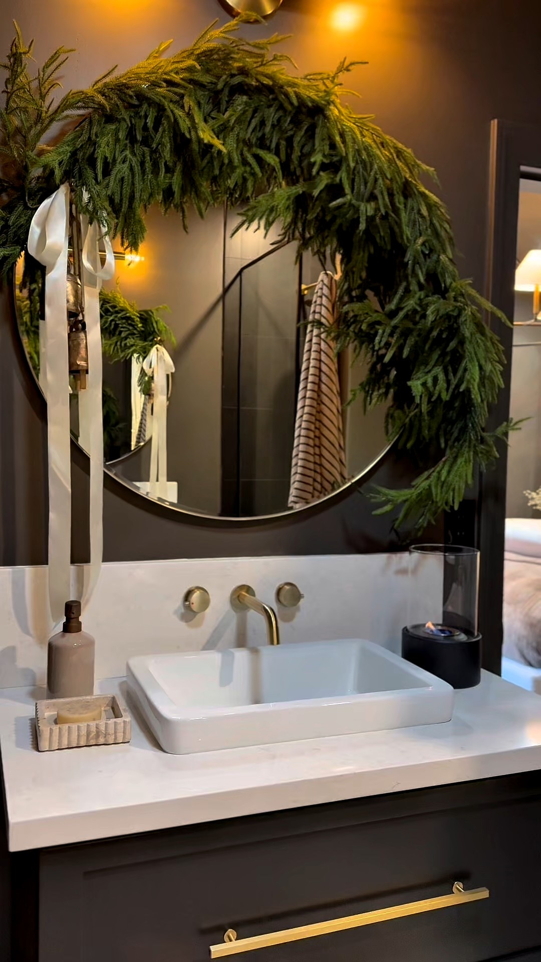 I love the touch of greenery this garland added to the bathroom made all the difference. Simple and beautiful! 

Bathroom decor. Garland. Faux greenery. Christmas decor. Festive home accents. Modern home. Gold accents. Guest bathroom. Powder room. 

 #LTKCyberWeek #LTKHome #LTKFindsUnder50