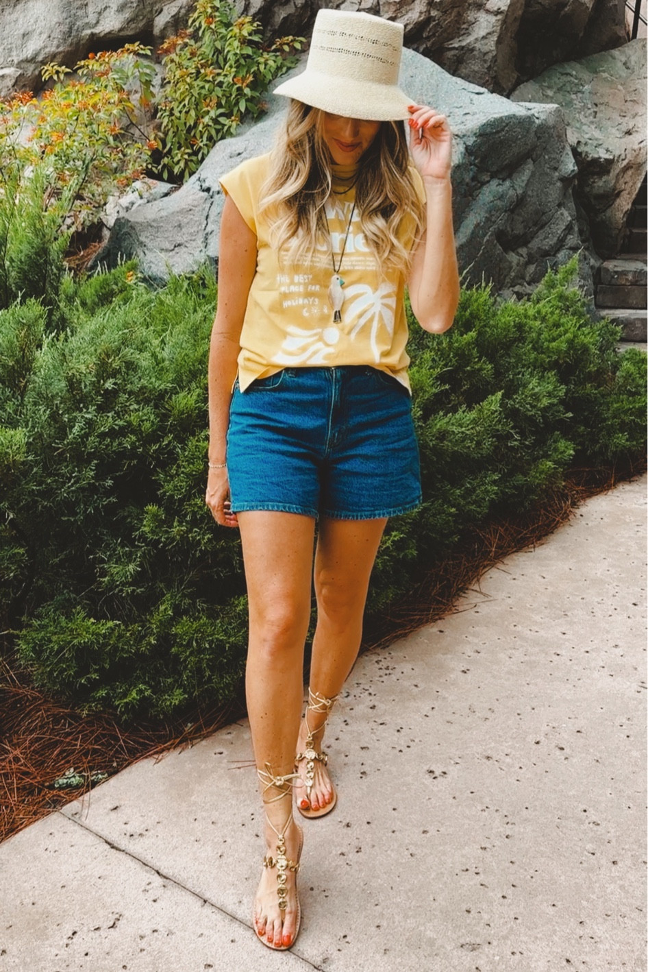 Summer outfit staples. Cute hat, comfortable and flattering denim shorts, cute top and statement sandals! I’m loving that gladiators and strappy sandals are making a major comeback!