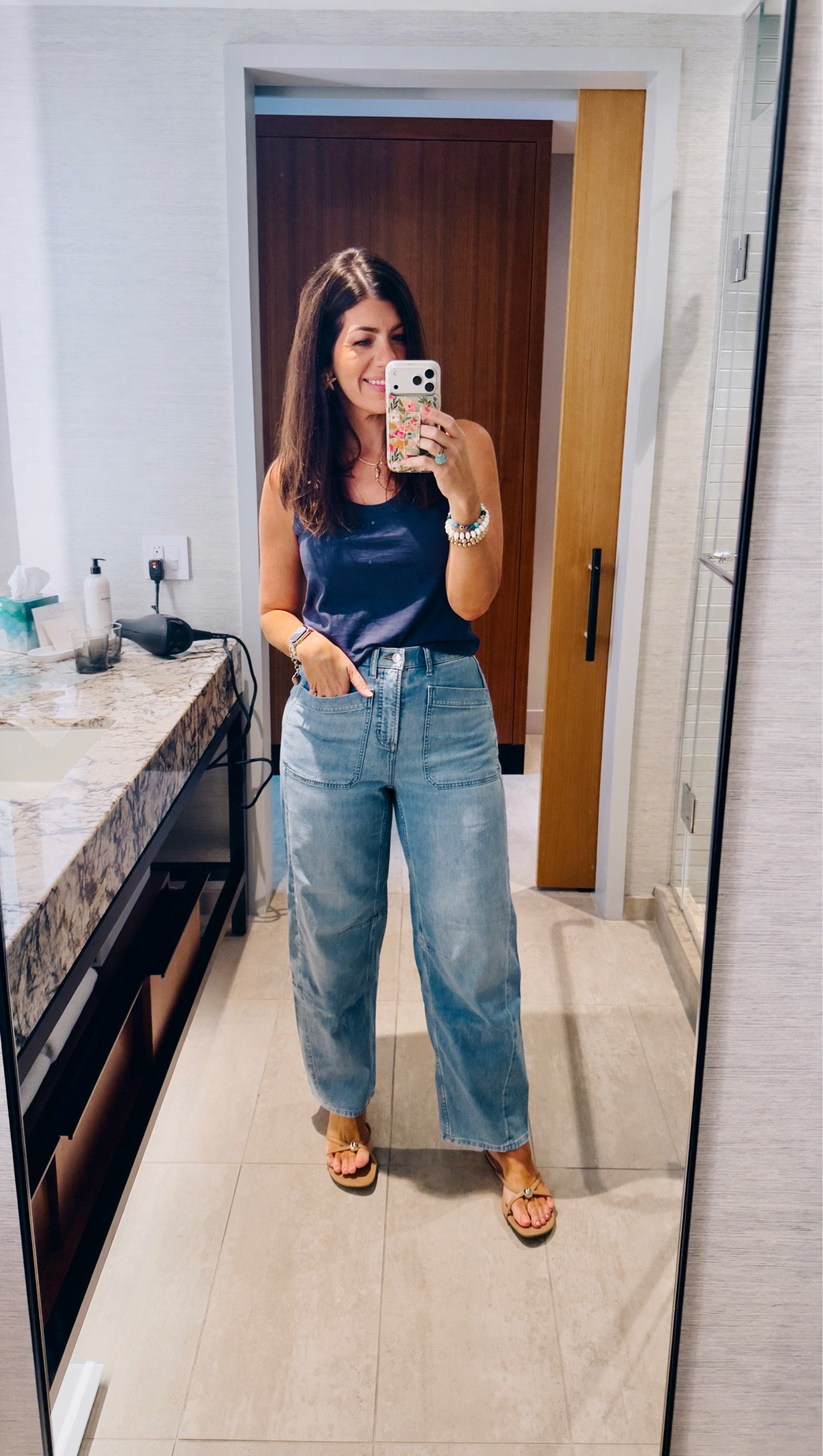 In a medium tank and small tall jeans (these ring big)

#LTKMidsize #LTKOver40 #LTKTravel