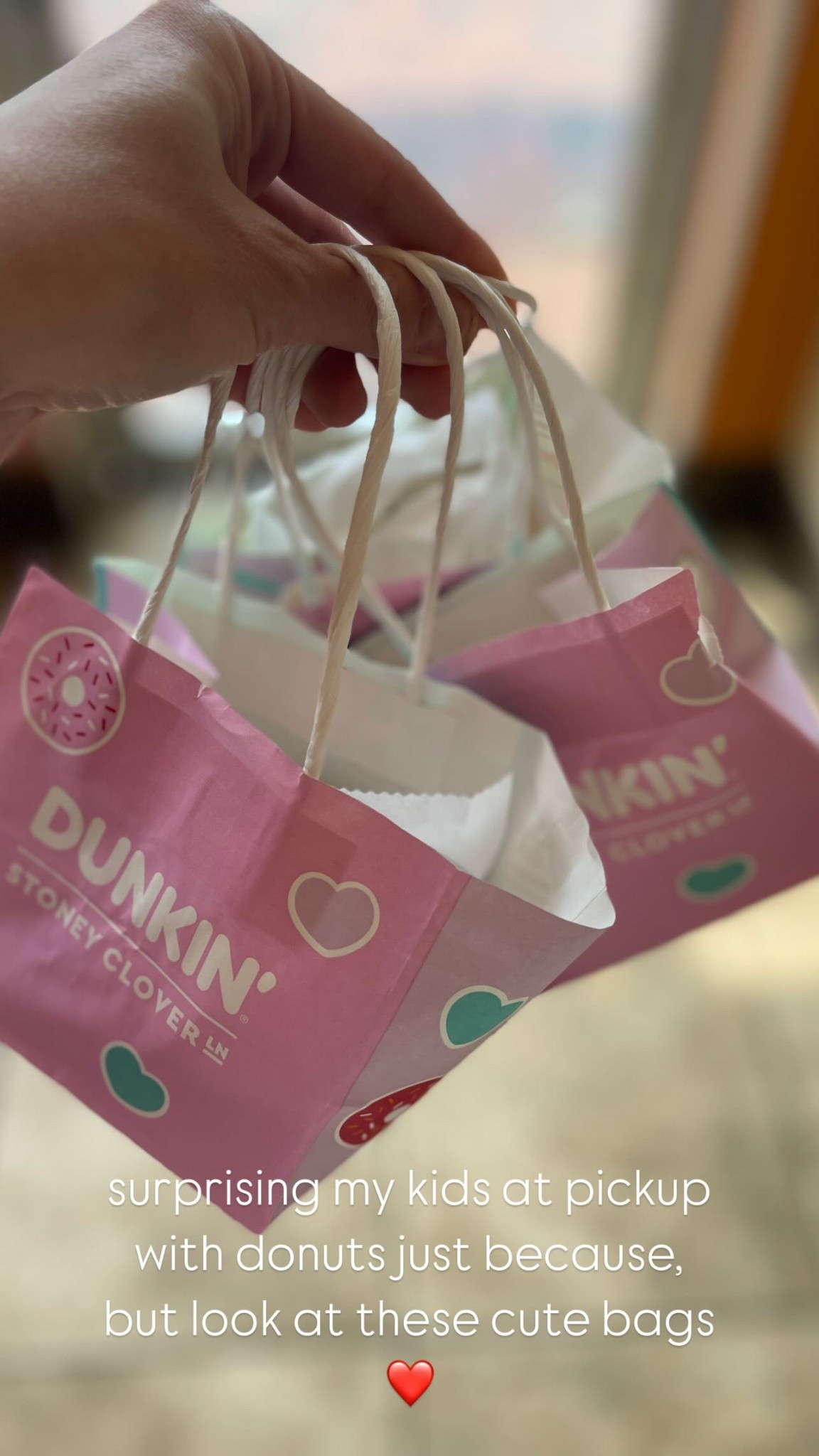 surprising my kids at pickup with donuts just because, but look at these cute bags ❤️