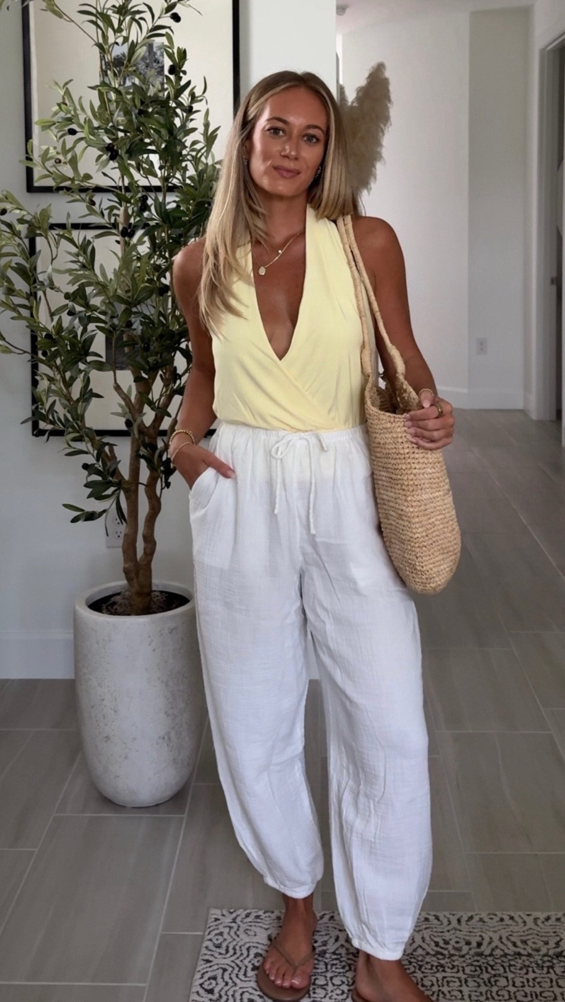 Styling my latest @Aritzia  haul, this butter yellow halter with linen balloon pants and a straw bag is perfection!

Wearing S in both

linen pants, balloon pants, halter top, yellow halter, straw bag, summer outfit, Aritzia outfit, elevated essentials, resort wear, vacation outfit, spring outfit, outfit inspo

#LTKootd #LTKSeasonal #LTKTravel
