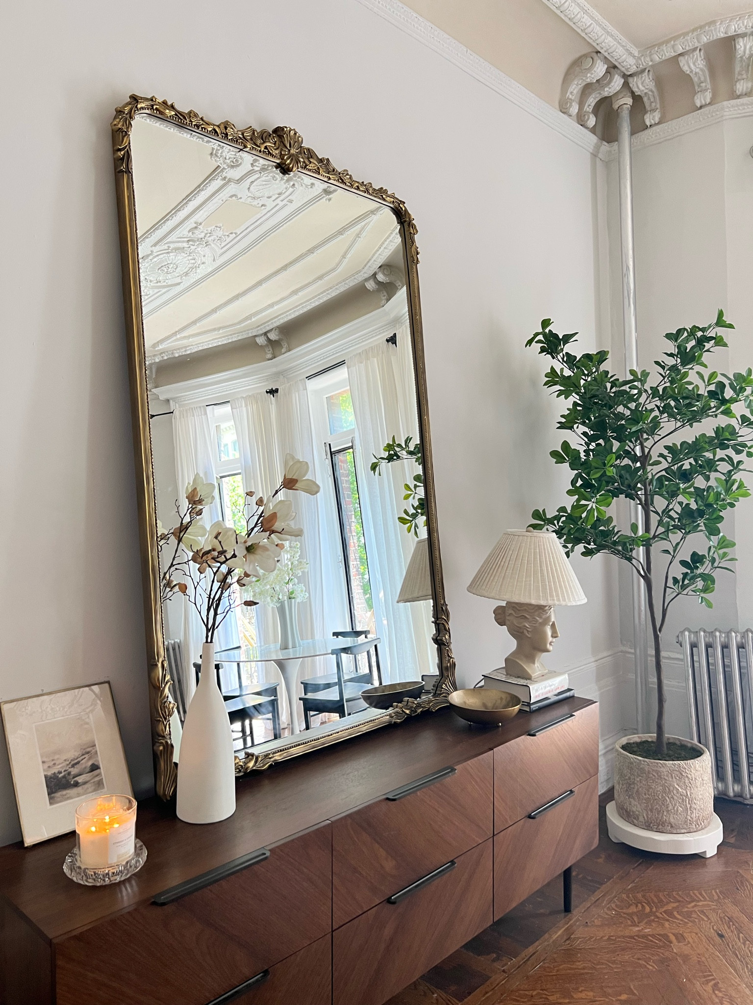 Large gold mirror, faux indoor tree, horizontal dresser, lamp 

#LTKFind #LTKhome #LTKsalealert