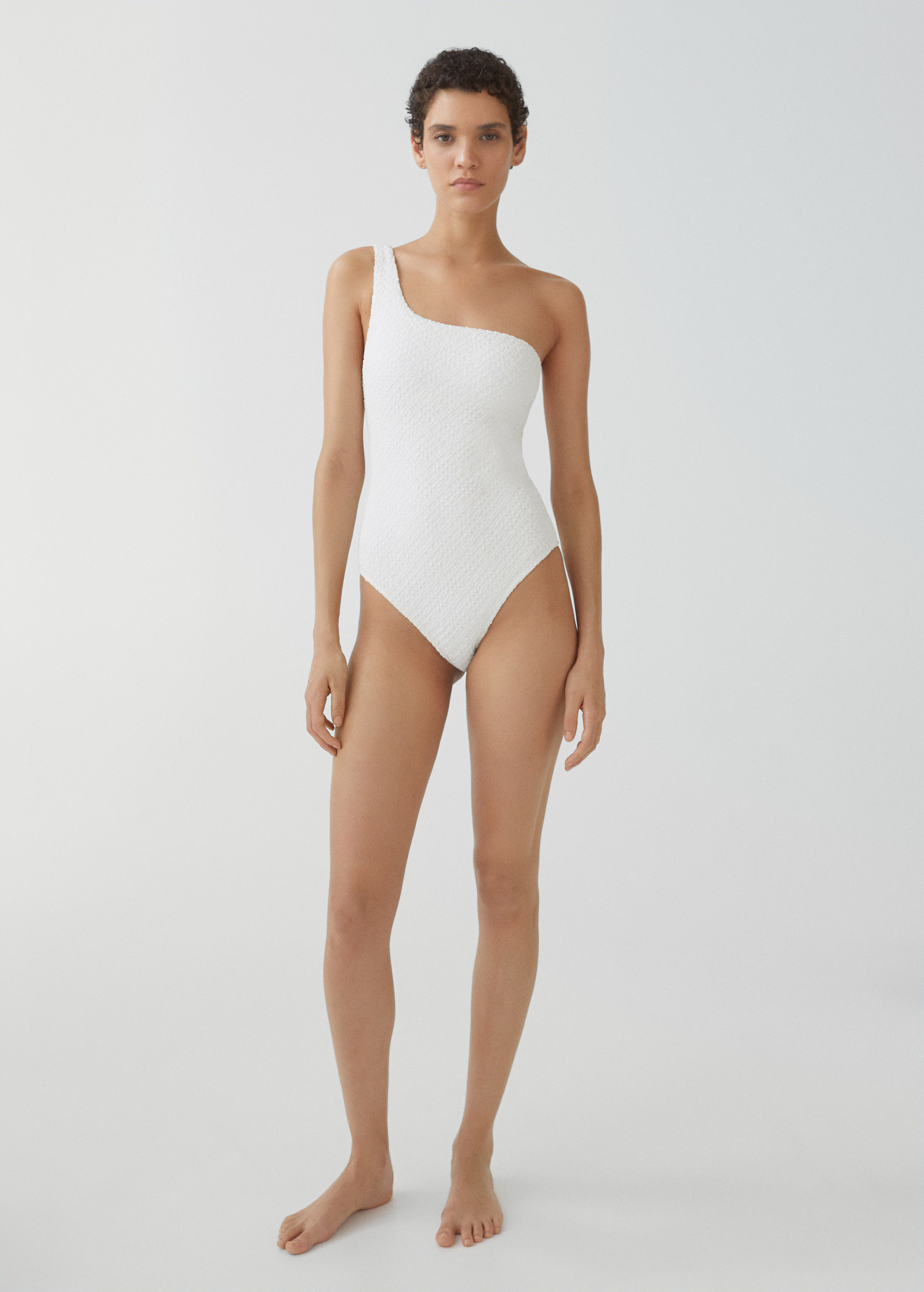Asymmetrical textured swimsuit | MANGO (UK)