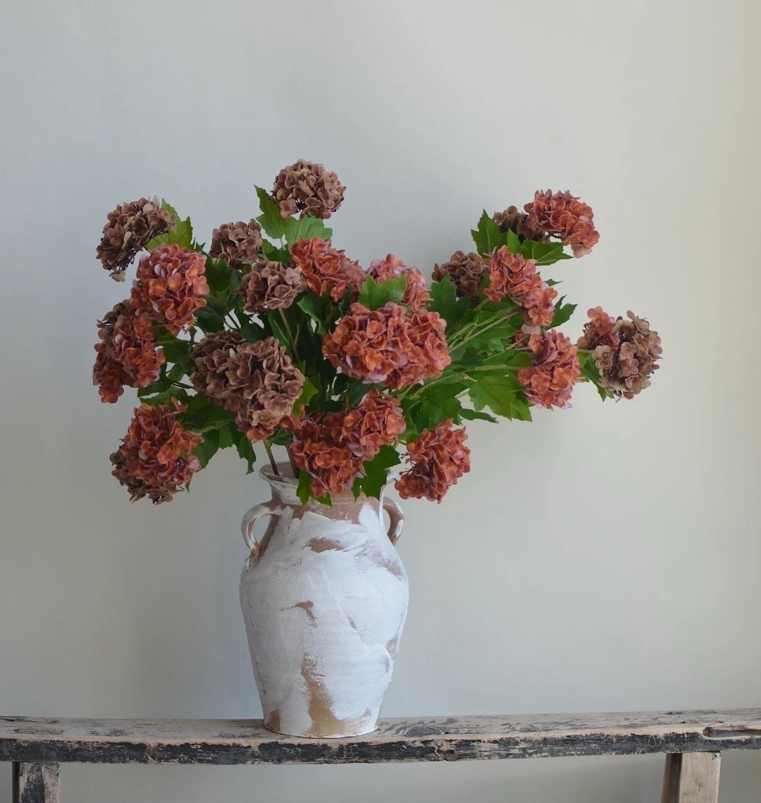 Create your own stunning fall arrangement with these beautifully detailed burnt orange and brown snowball stems from DexinFloral. Featuring real-touch blooms, rich autumn tones, and wired stems for easy shaping, they offer endless possibilities for crafting vintage-inspired displays. At 25 inches tall with full, lifelike blossoms, these stems bring warmth and texture to any DIY project. Perfect for seasonal centerpieces, wreaths, or bouquet designs. #FallFlorals #DIYDecor #CraftSupplies #AutumnVibes #EtsyFinds #FauxFlowers

#LTKHome #LTKSeasonal #LTKHoliday