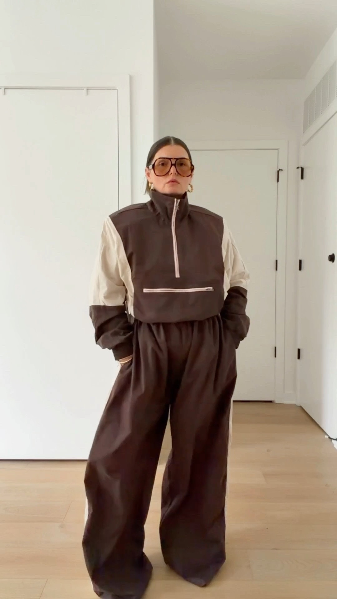 This is a super soft cozy nylon track set. 
Pants are pretty long. I’m 5’4” wearing them as high as they’ll go and there’s still a few inches of length dragging
