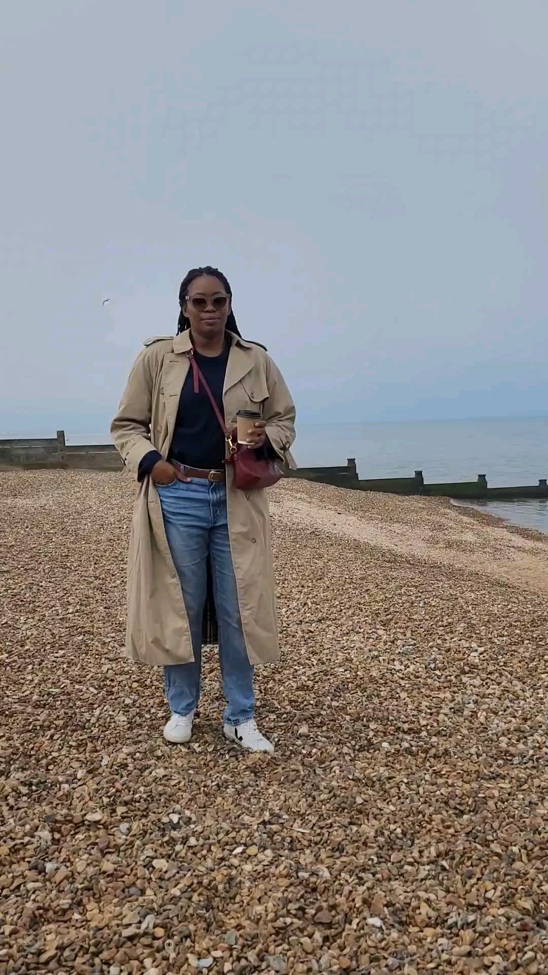 Spring Outfit Formula: jeans + jumper + Trenchcoat = Elevated Casual Outfit.Veja trainers, straight leg jeans, trench coat, navy blue jumper, burgundy clutch bag.#ltkuk #ltksummer #ltkover40 #outfitinspiration 

#LTKAprilSpotlight #LTKspring #LTKmodest