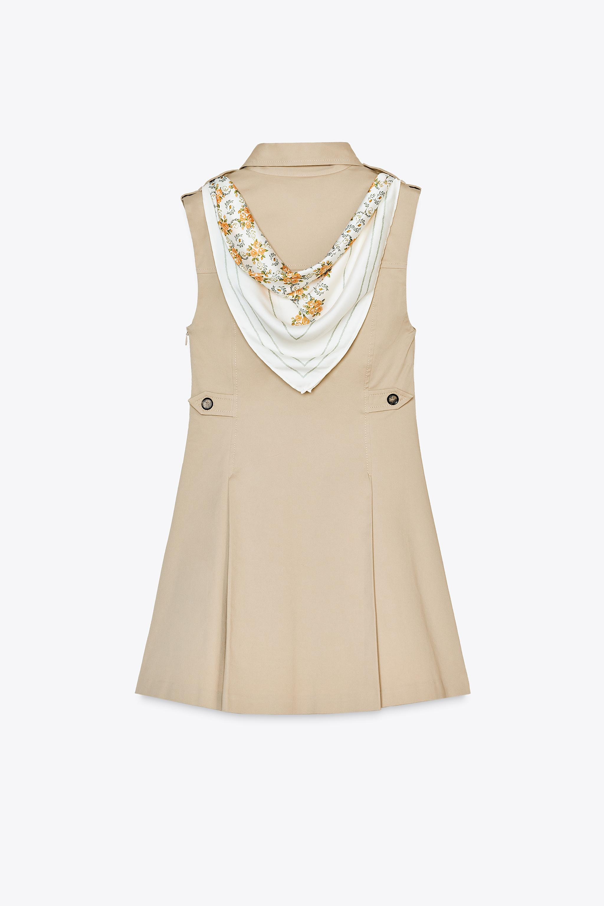 Short gabardine dress. Lapel collar with metal clasp and sleeveless. Belt loops and printed scarf... | Zara US