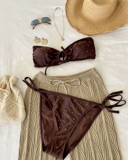 Vacation Mode! 
This two piece bikini fits Comfy and is stretchy. 
The top is One Size. I sized up on the bikini. Lovely gold beaded detail. 

For reference I’m 5’7” 150lbs. 

Brown bikini. Brown swimwear. Gold accessories. Straw beach hat. Ray-Ban sunglasses. Neutral beach pants. 

#LTKSeasonal #LTKtravel #LTKswim